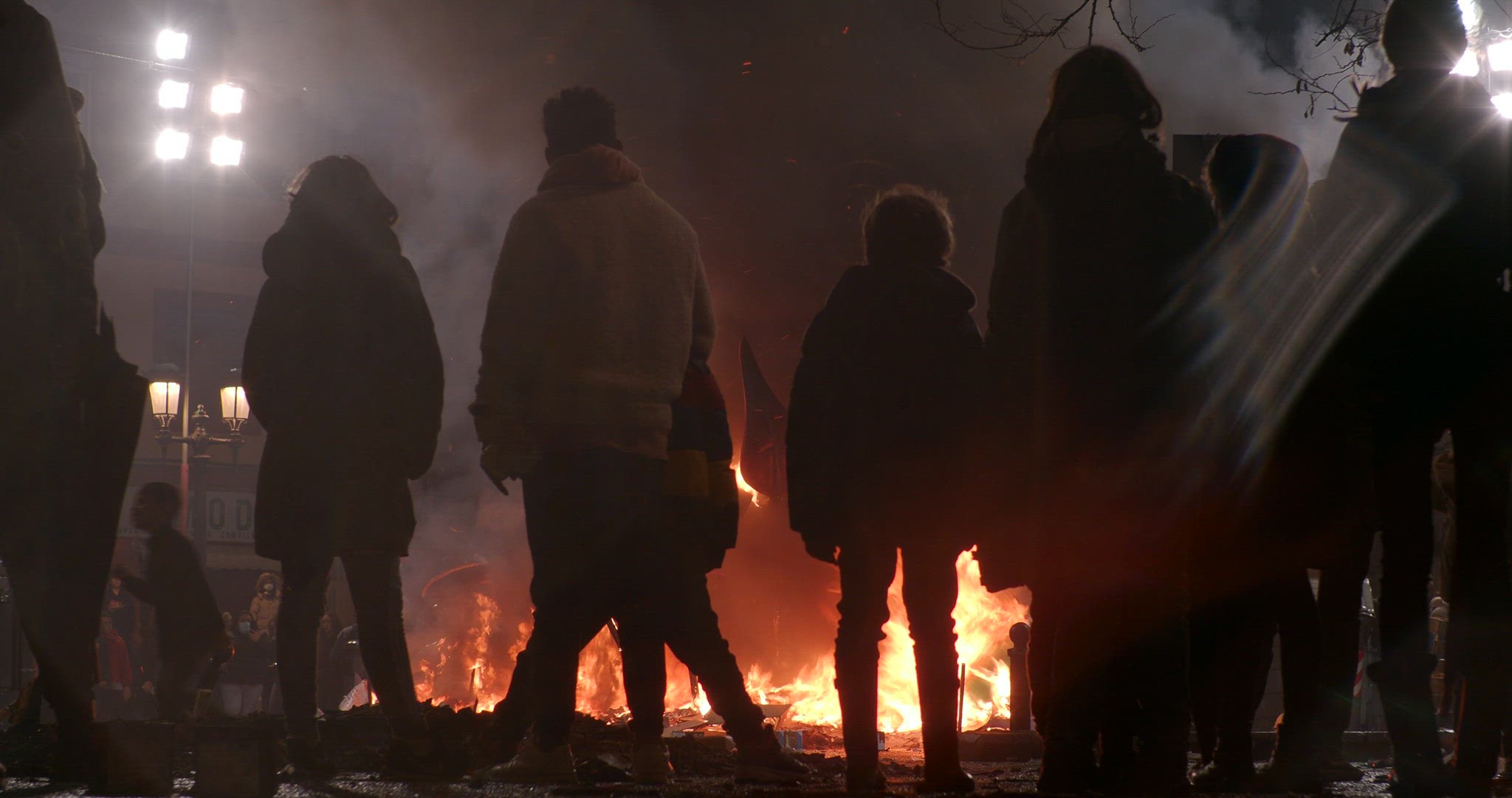 Fallas celebration and people watching burning ninots, Spain