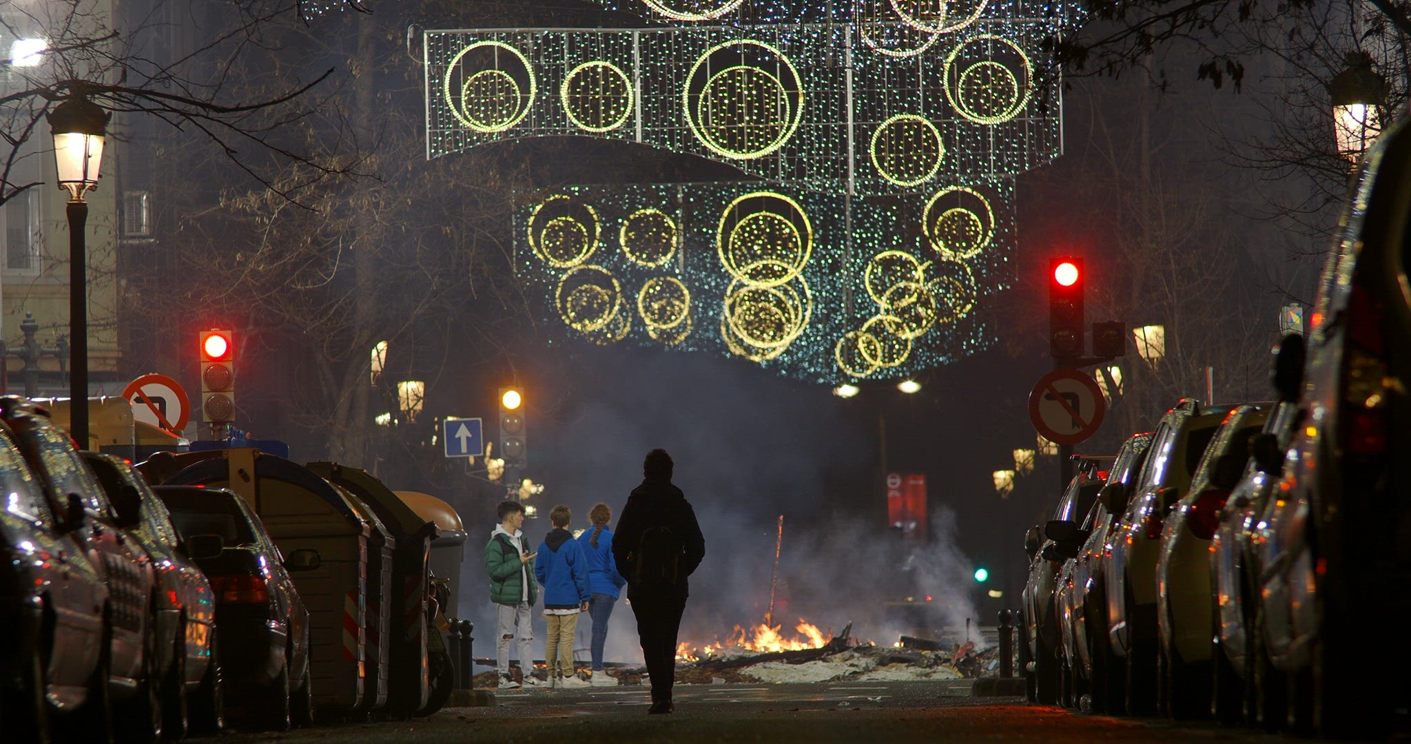 Street view with people and bonfire at Fallas night, Spain