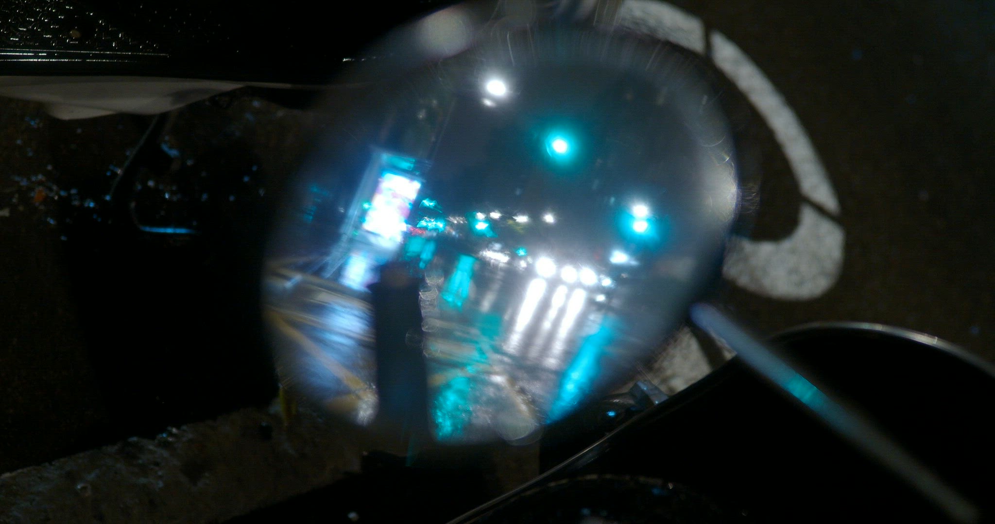 Transport traffic under the night rain, motorbike mirror reflection