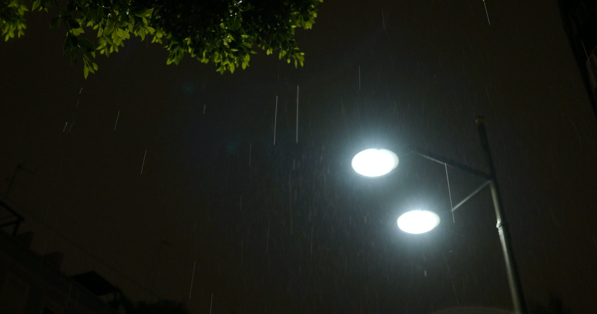 Street lantern under the rain at night