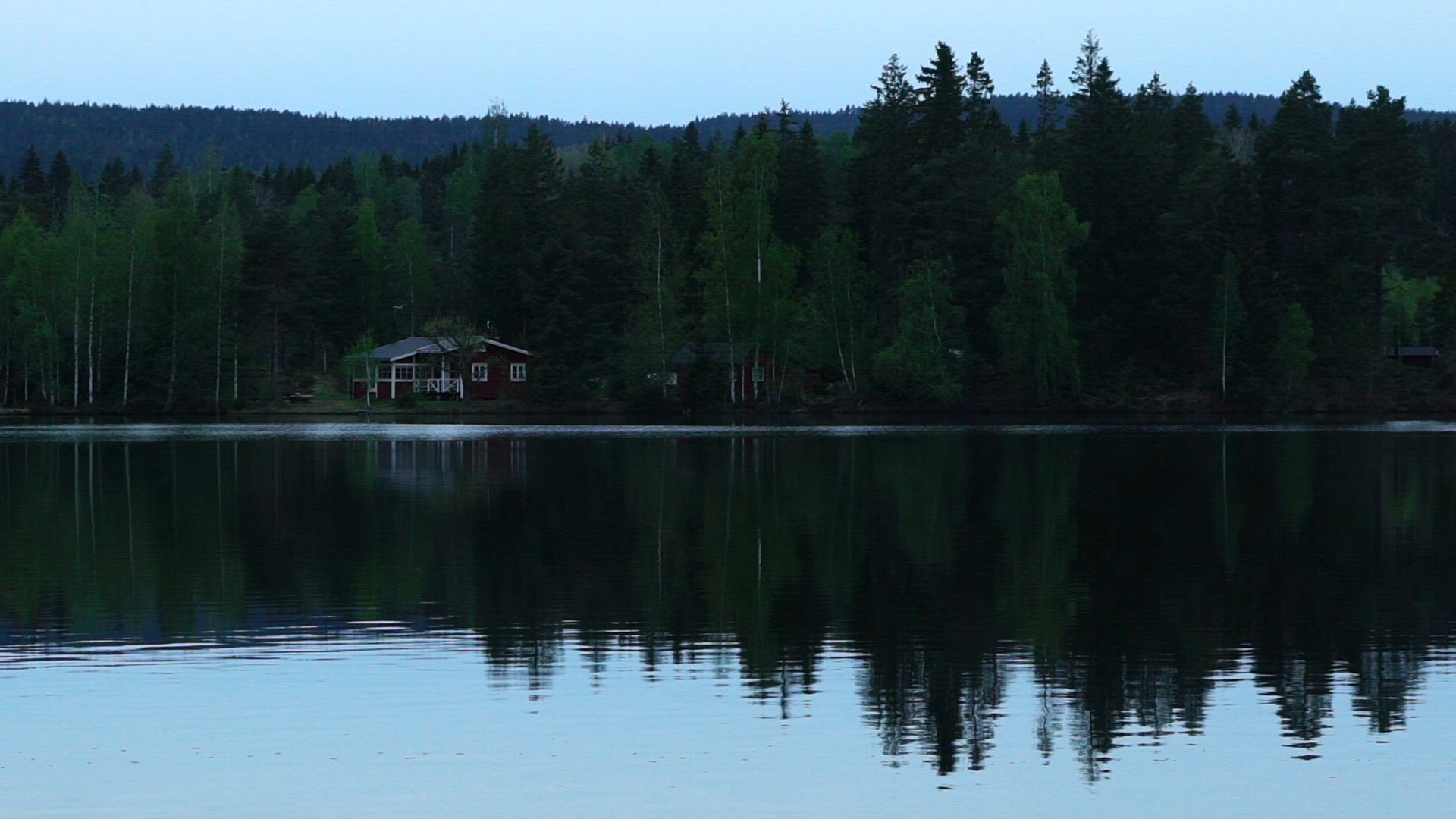 summer cottage close to lake - in forest - evening - summer night - slow motion