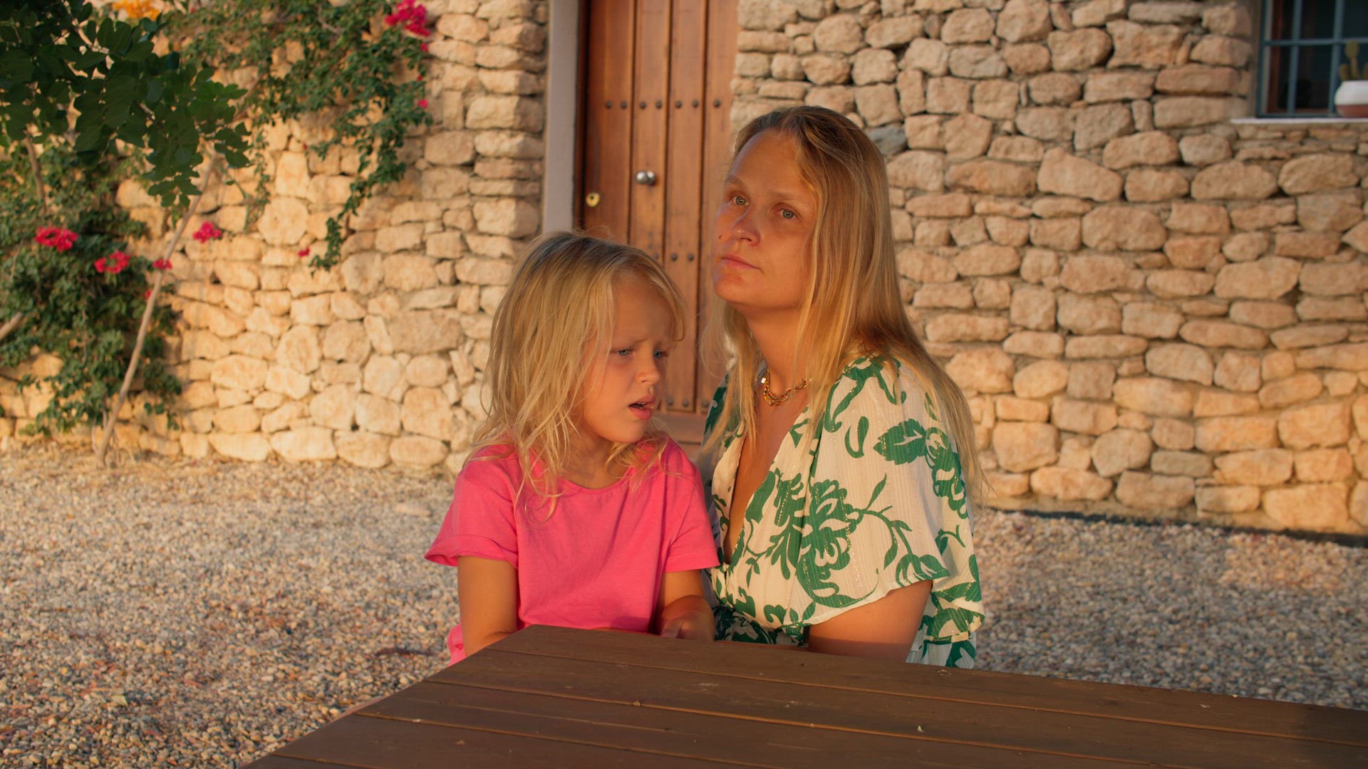 Mom talking to her little daughter