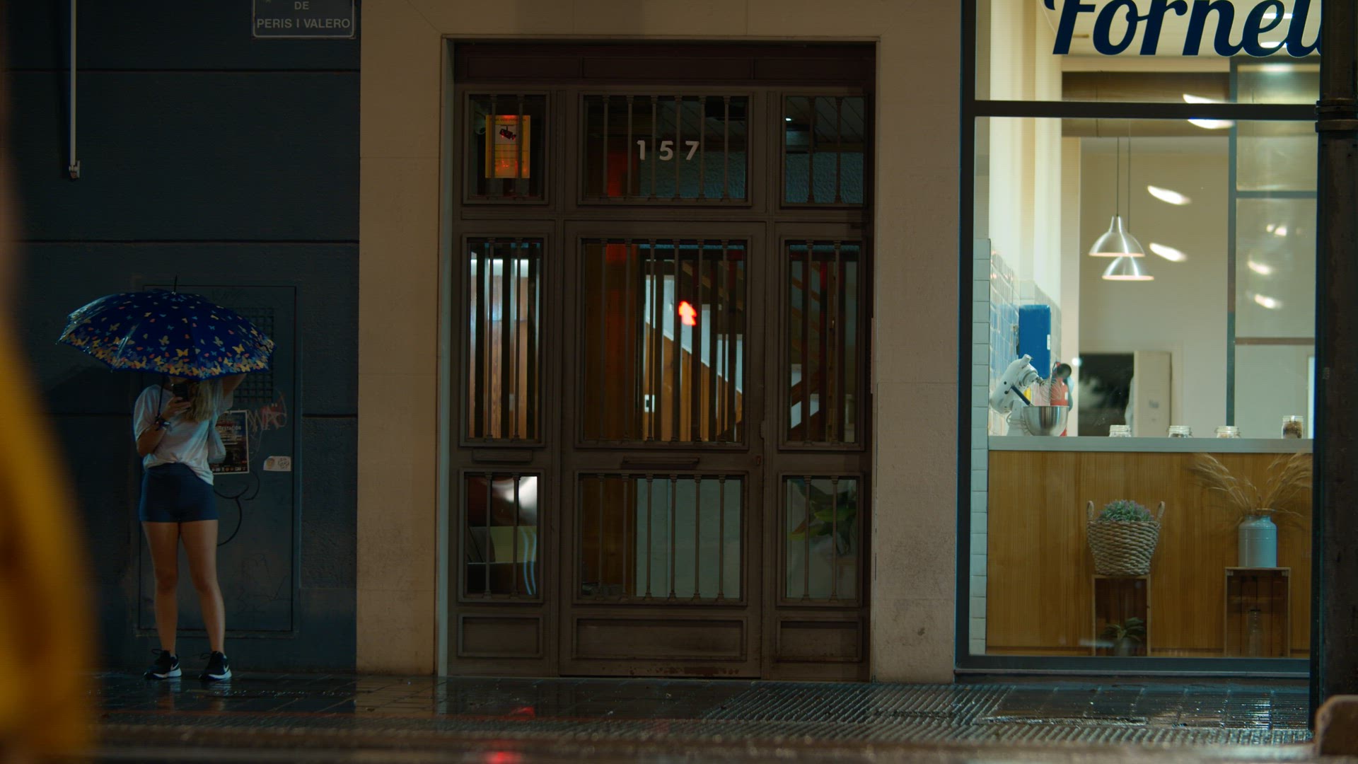 Girl under an umbrella on the street