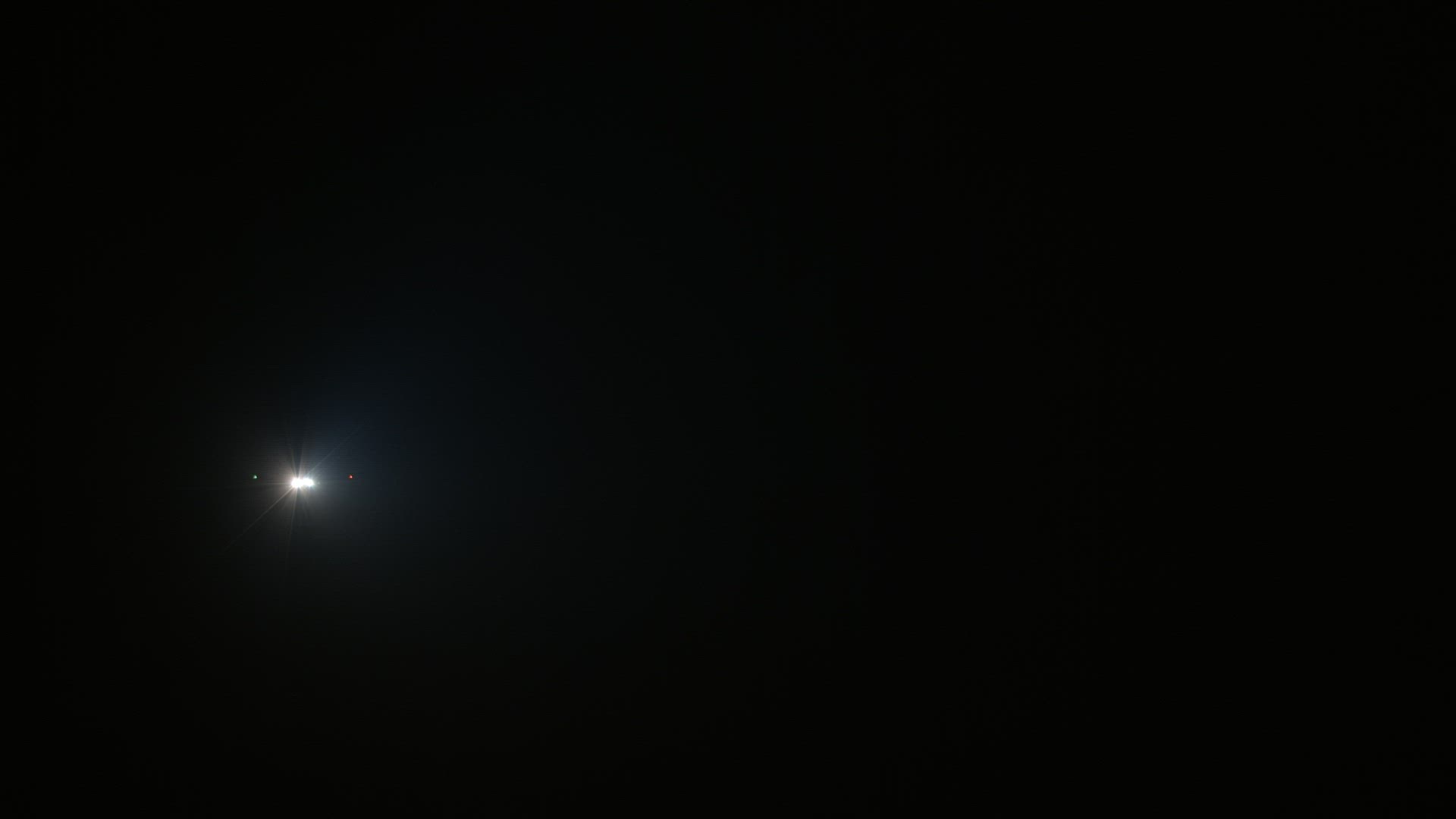 Airplane lights in the night sky