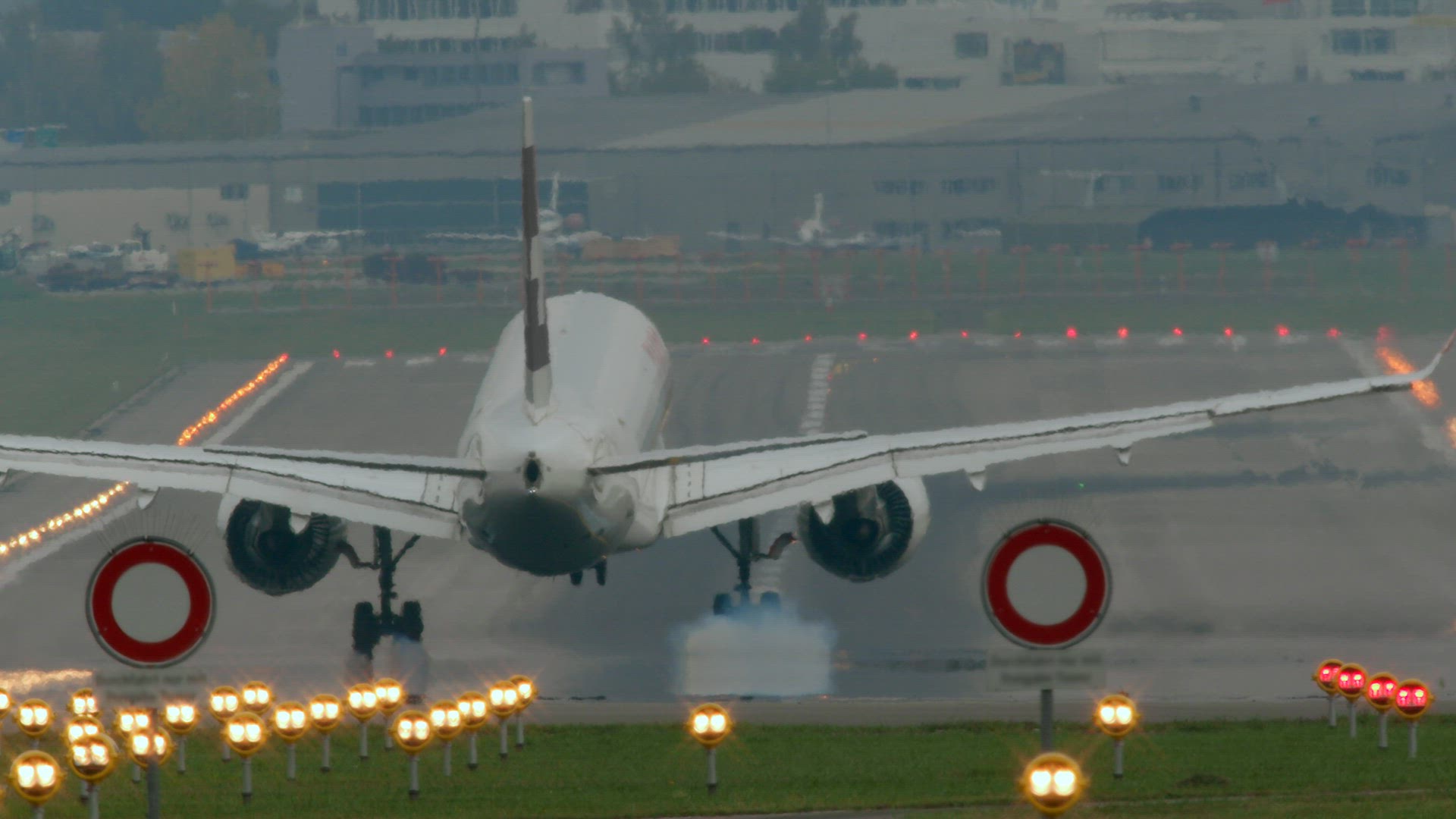 Slow motion - jet plane landing at the airport