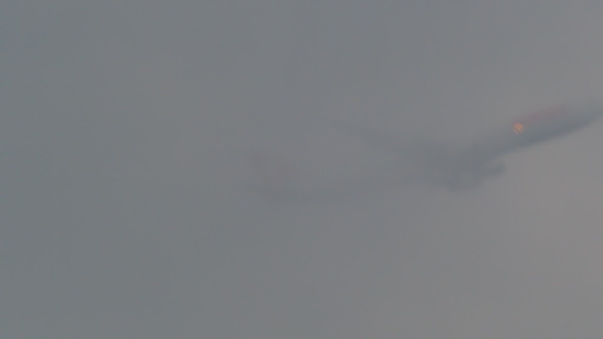 Airplane flies through the clouds