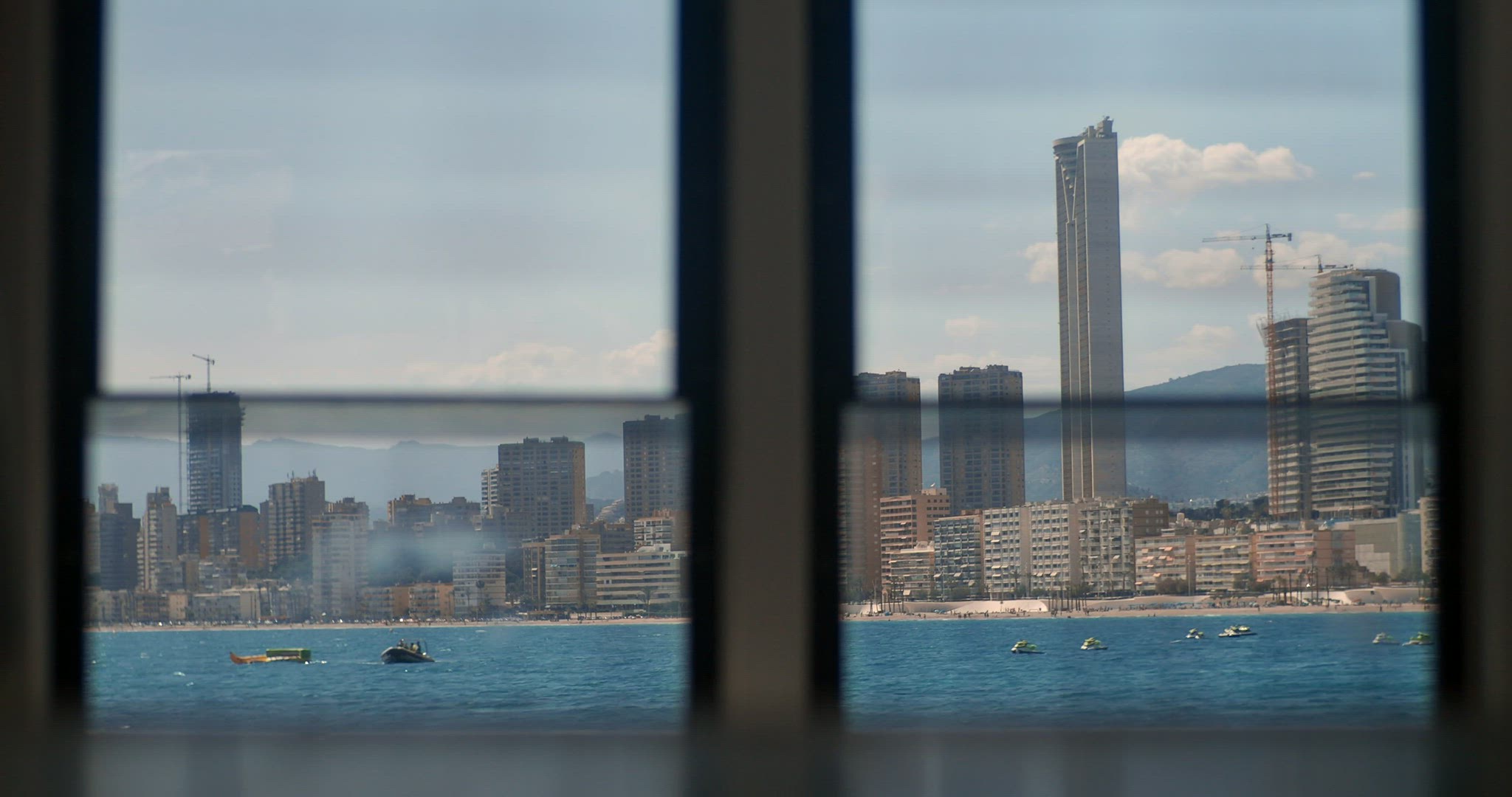 View of the coastal town through the boat window