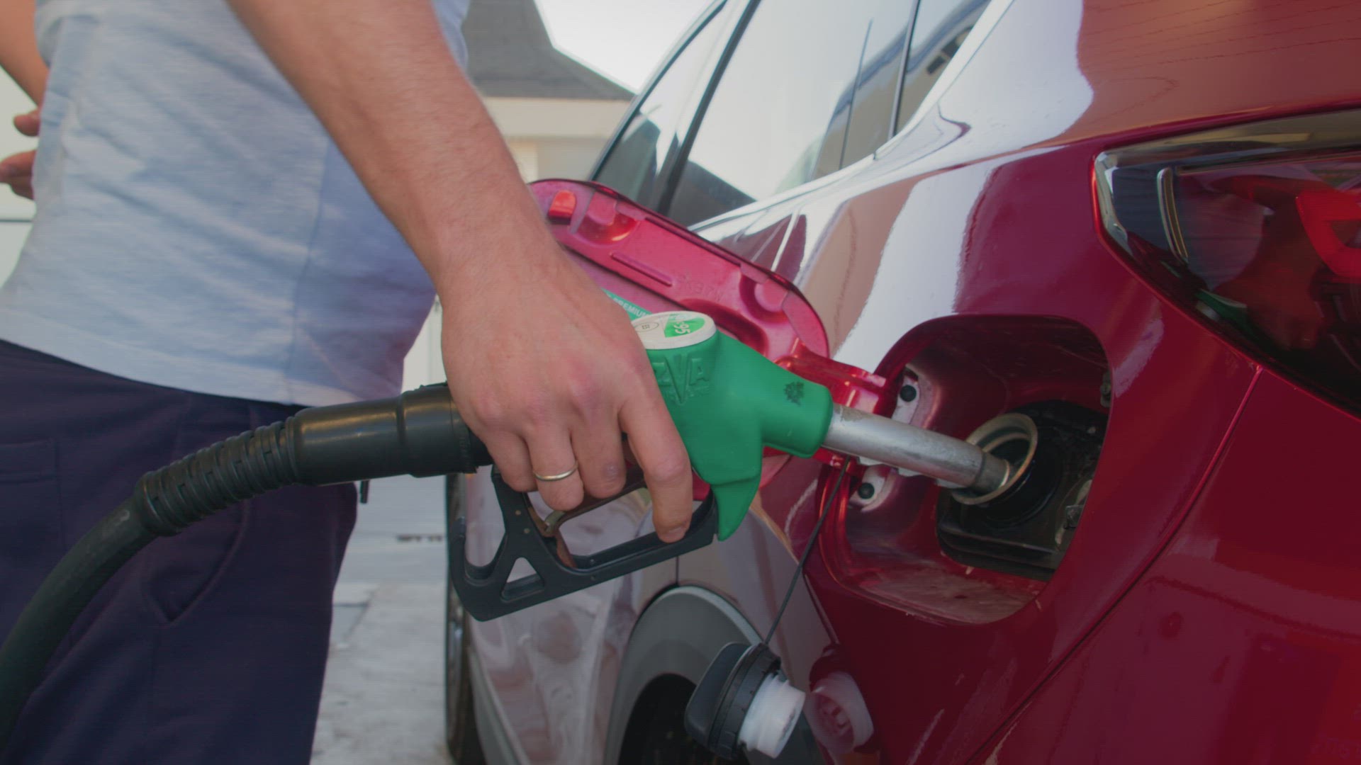 Man fueling his car with gasoline