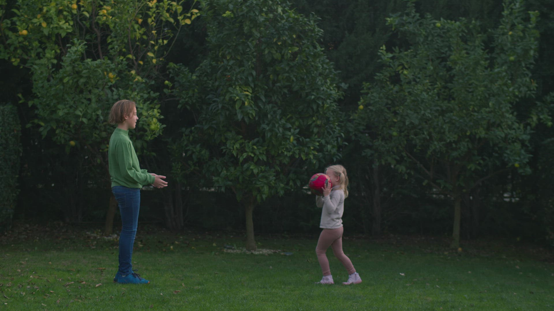 Playing Edible or Inedible Game with Siblings in the Backyard