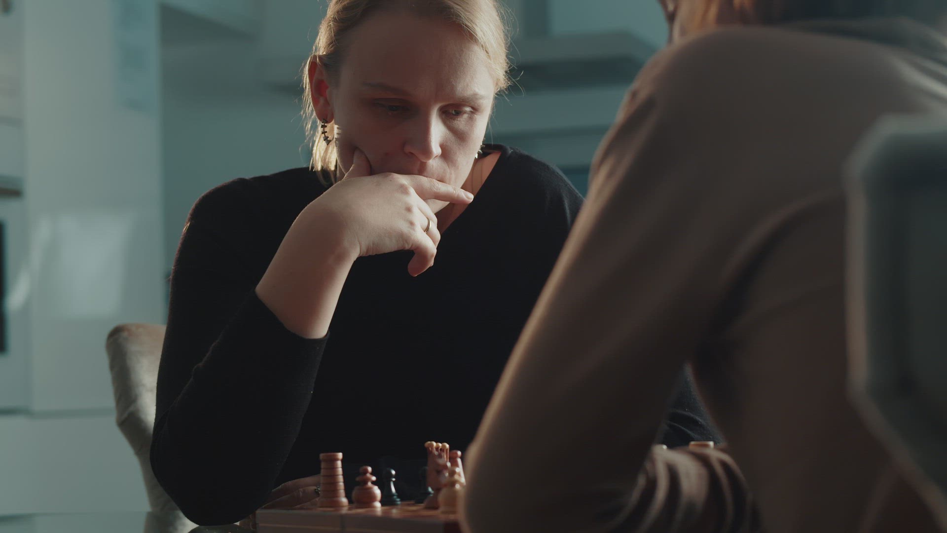 Mother and Son Share a Special Moment Over Chess
