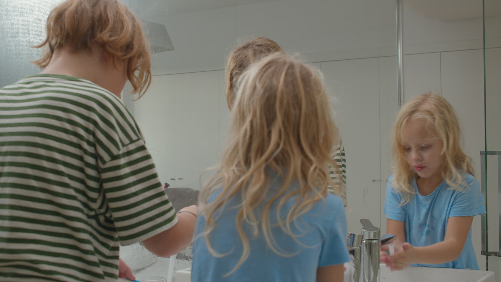 Siblings Washing Face Together in Bathroom