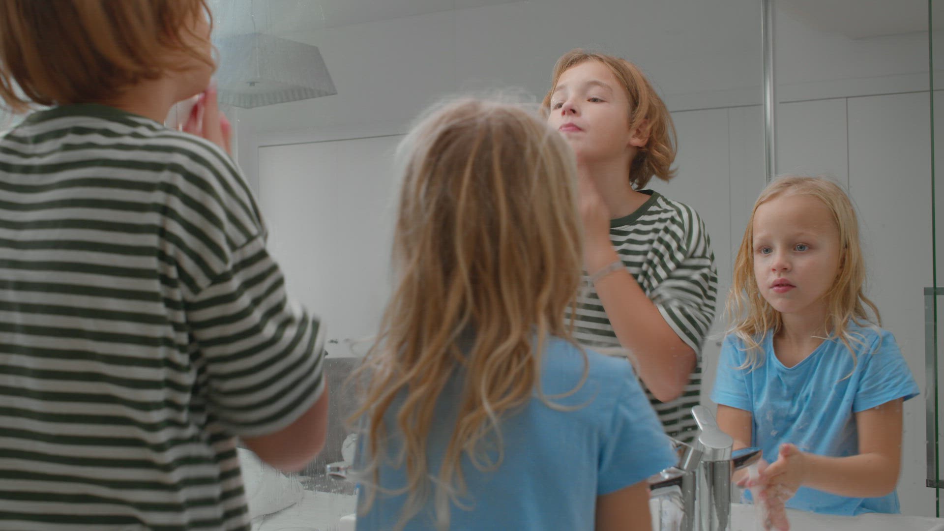 Siblings morning routine in bathroom