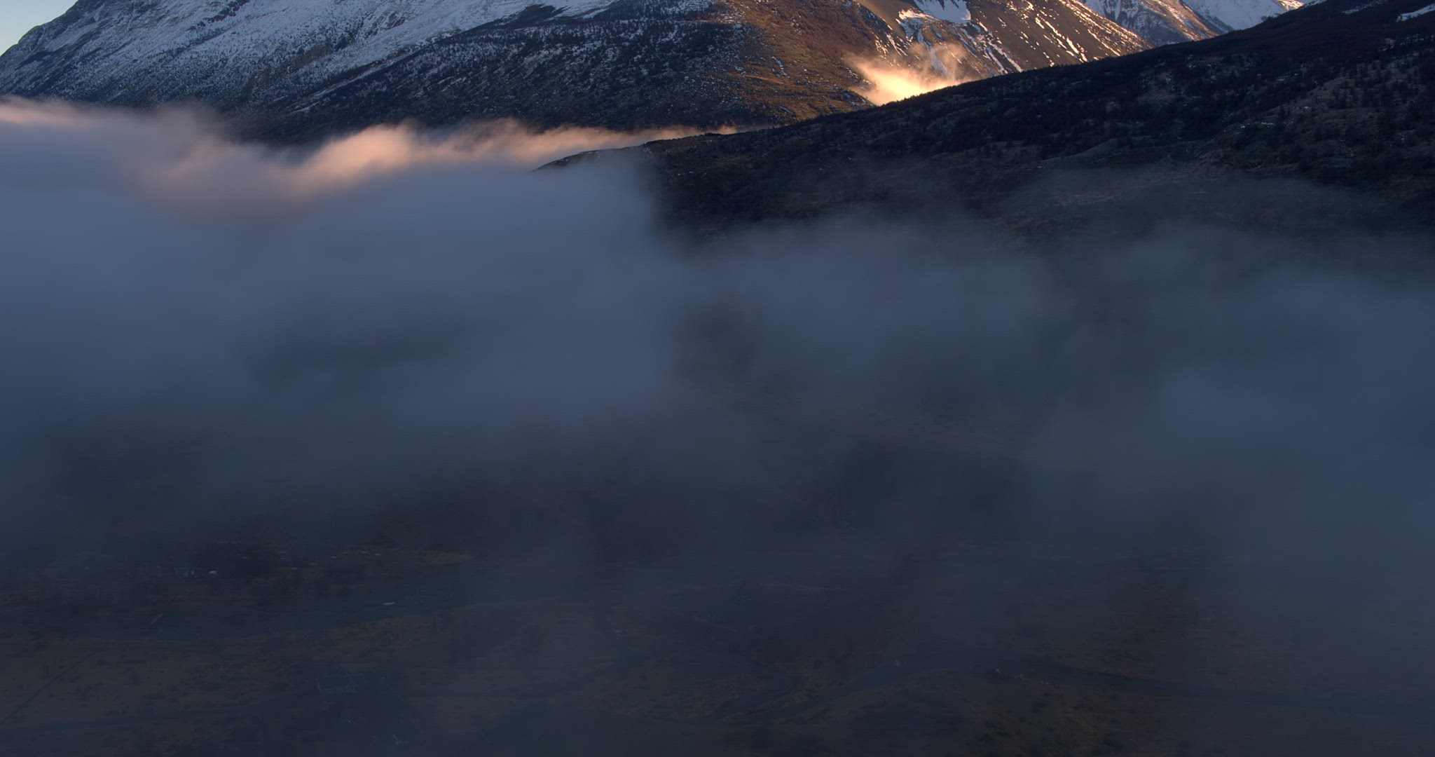 Aerial Pan Up Above Clouds