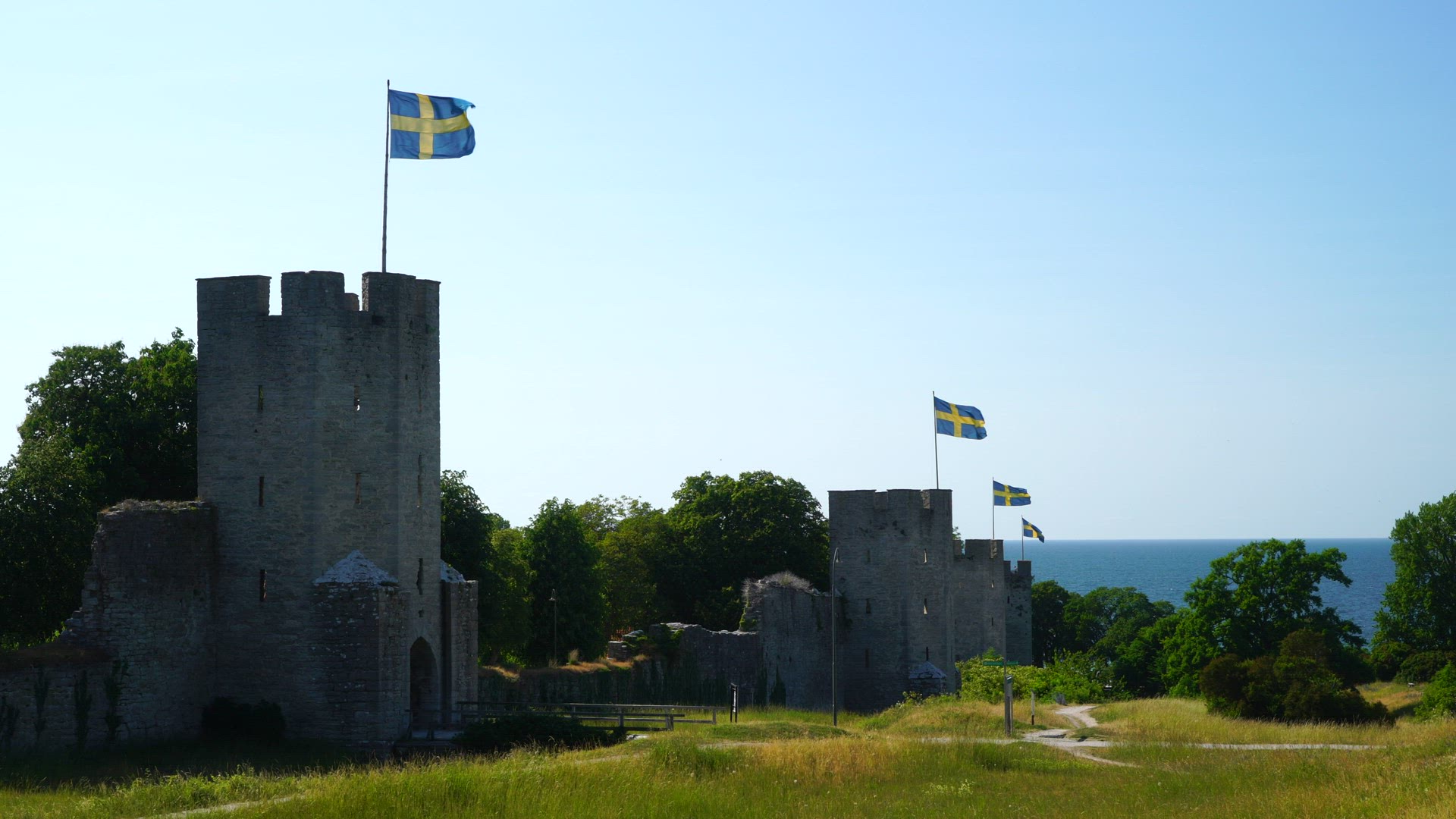 Visby City Wall - swedish flags in strong wind - no people