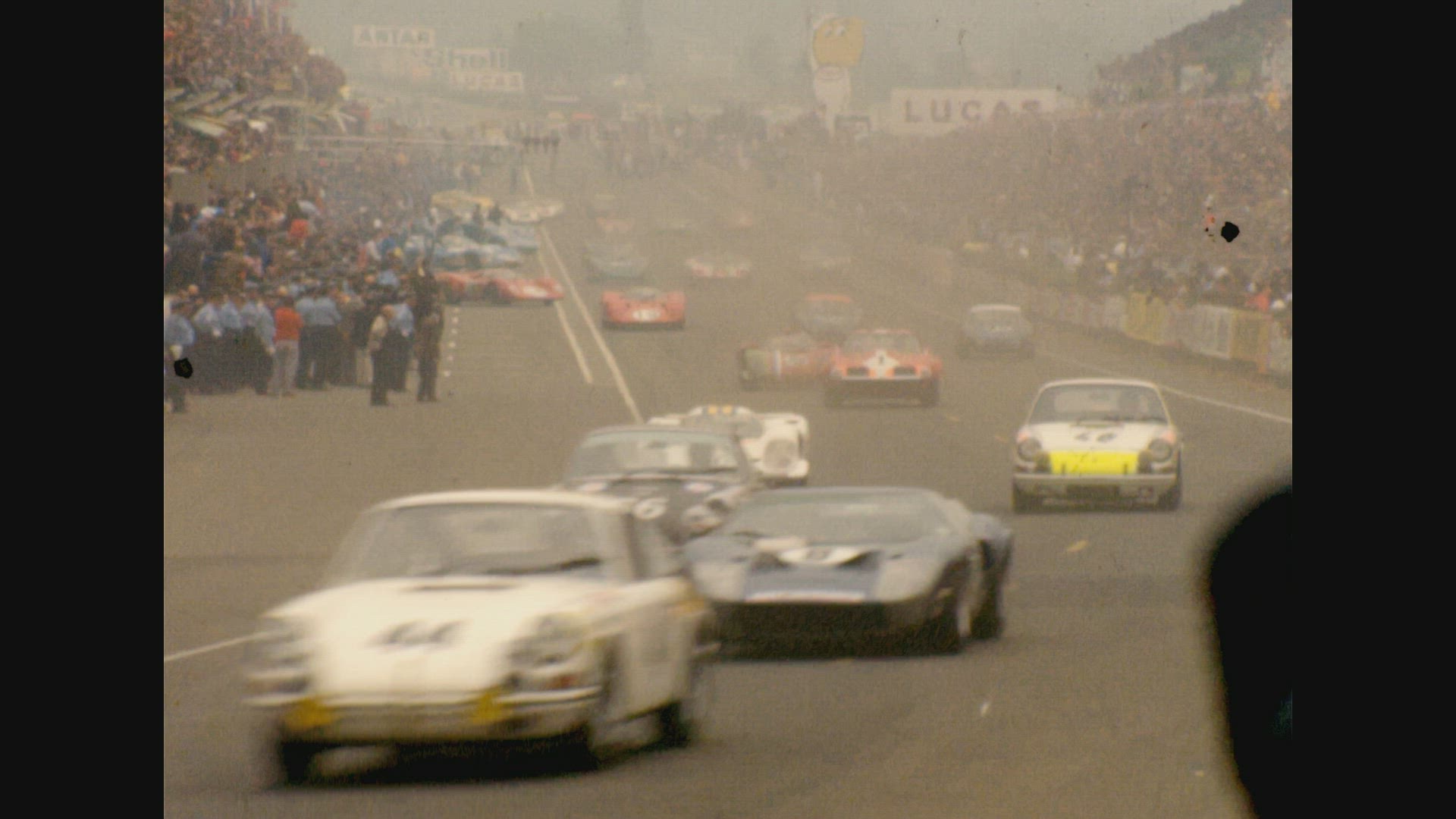 Cars no. 1 , 10 , 38 , 44, 46 take curve towards camera (Le Mans 24 Hour Race)