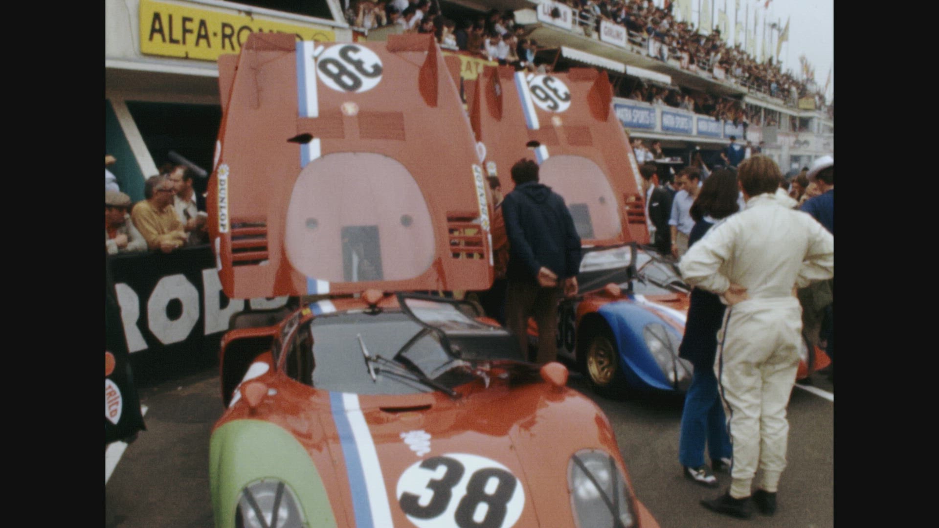 Cars no.18, 38, 39  sitting idle before race (Le Mans 24 Hour Race 1969)