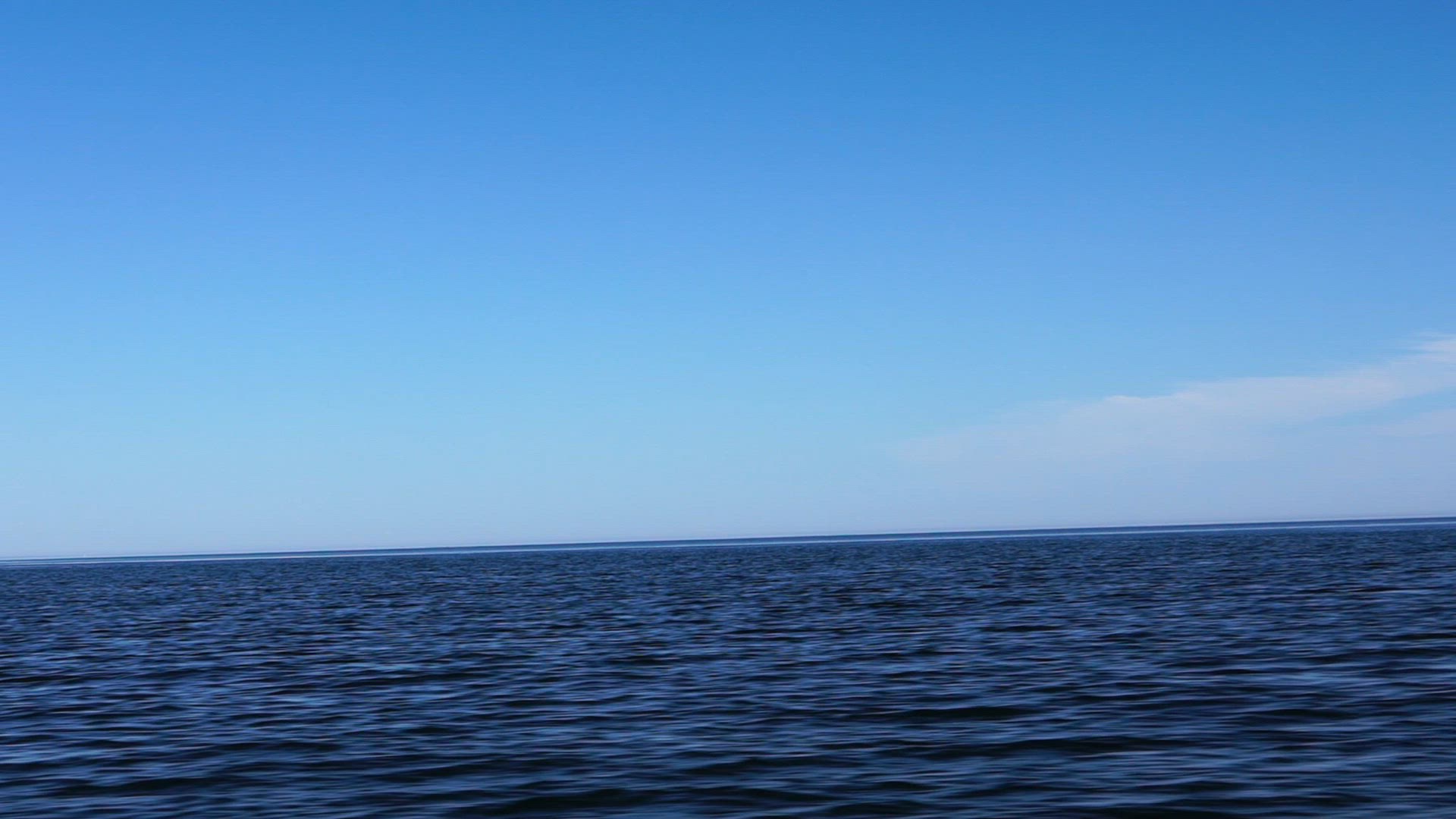 point of view from boat - side view - water - baltic sea - boat moving - slow motion shot