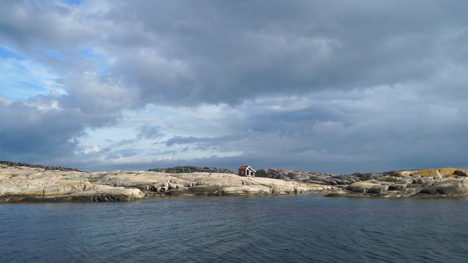 vieiw over sparse landscape with cliffs and small tool shed in Bohuslän on swedish west coast