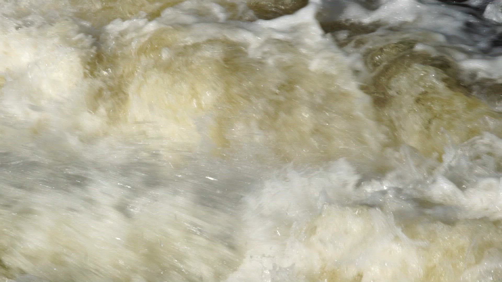 rapids - waterfall - streaming water - slow motion shot - hydroelectric