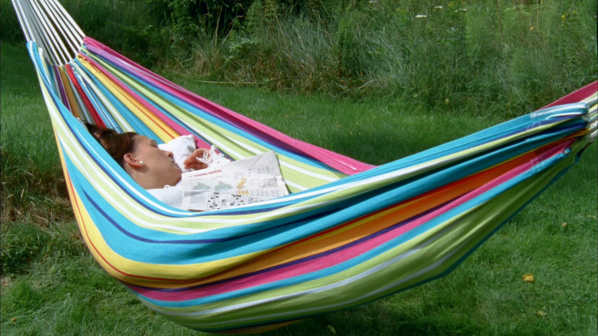 woman lying in hammock - resting - relaxing