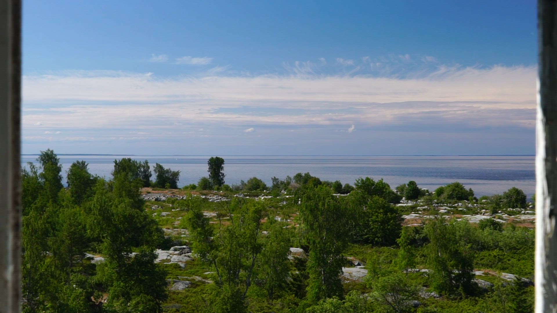 point of view through open window at stubbens fyr - Ostrobothnia in Finland - slomo - Baltic sea