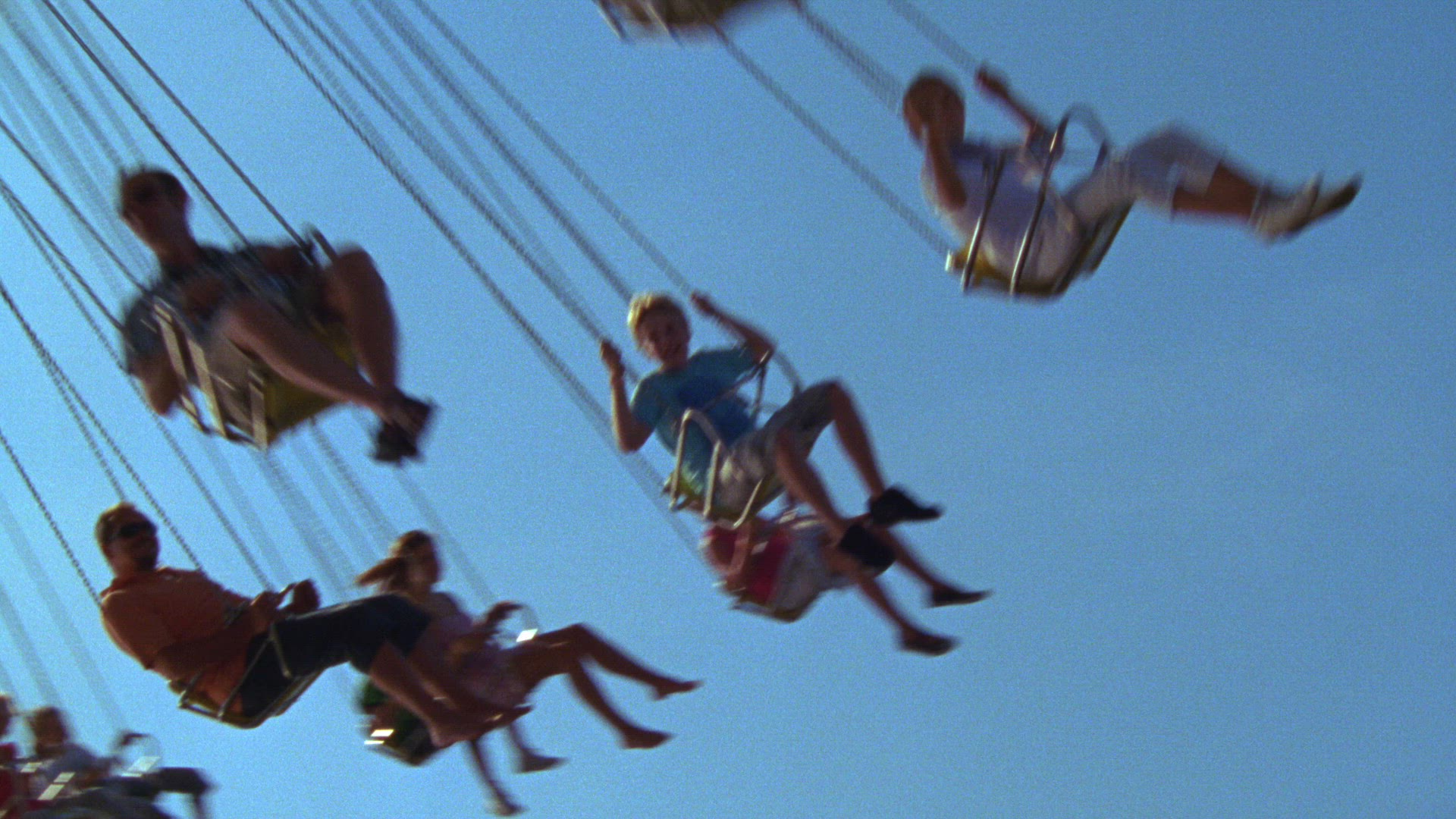 people in carousel at amusement park
