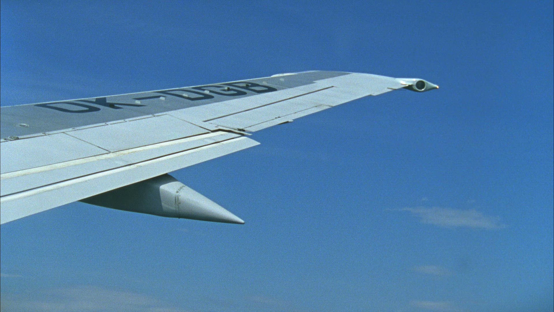 aircraft wing during flight - point of view from inside aeroplane - descending