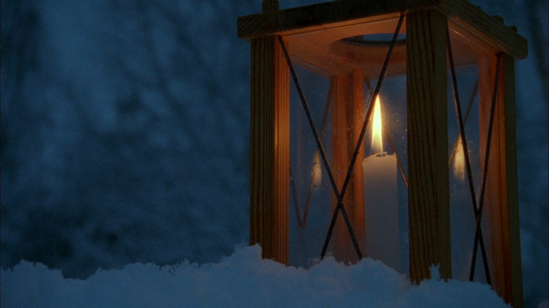 lantern in snow - candle burning - four shots