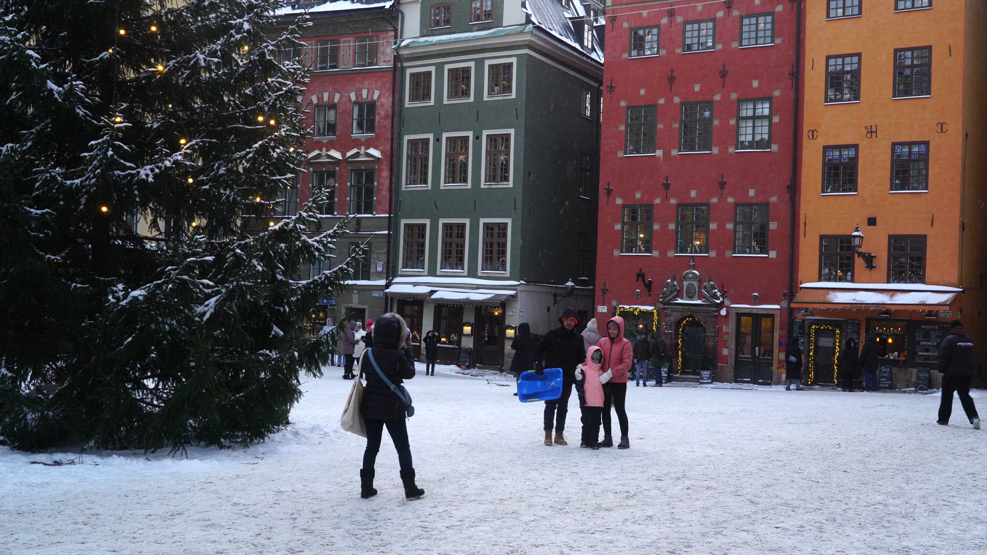 tourists taking pictures at Stortorget in Old Town Stockholm - photographer