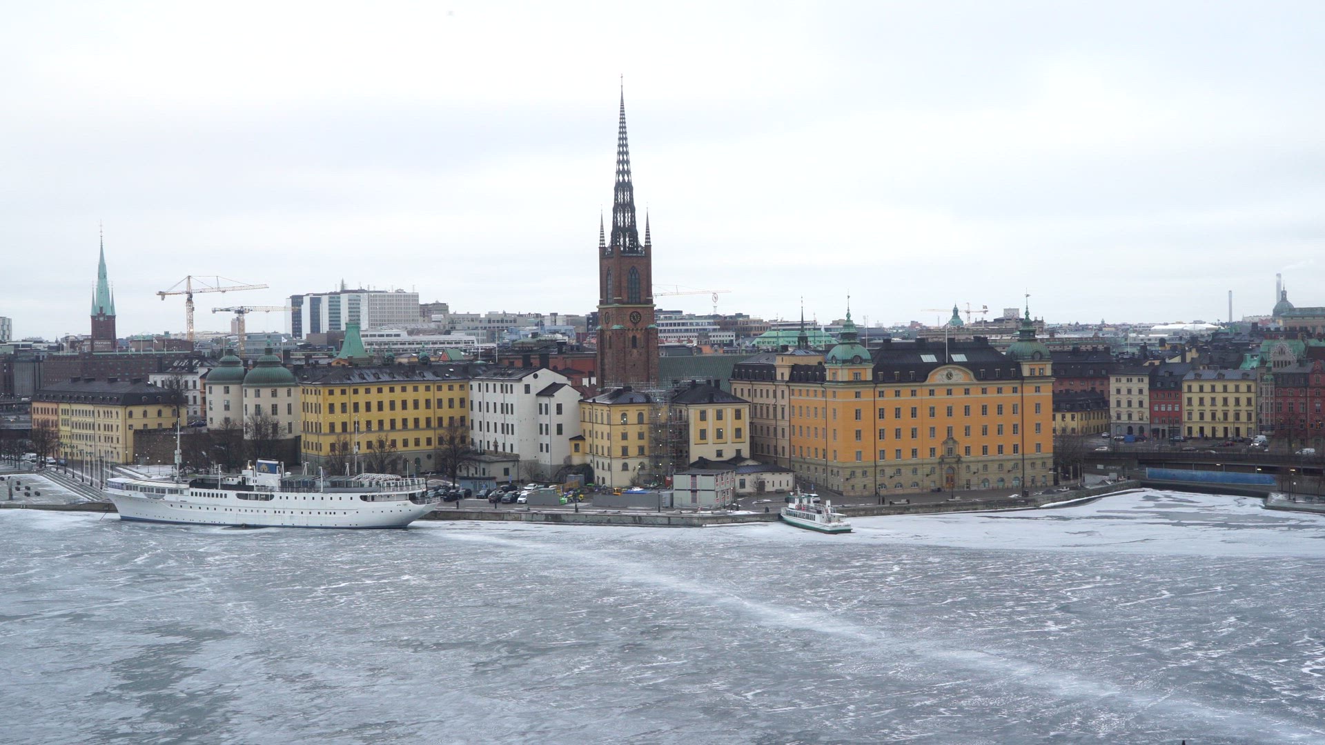 view over riddarholmen and central stockholm - ice on riddarfjärden - wintertime