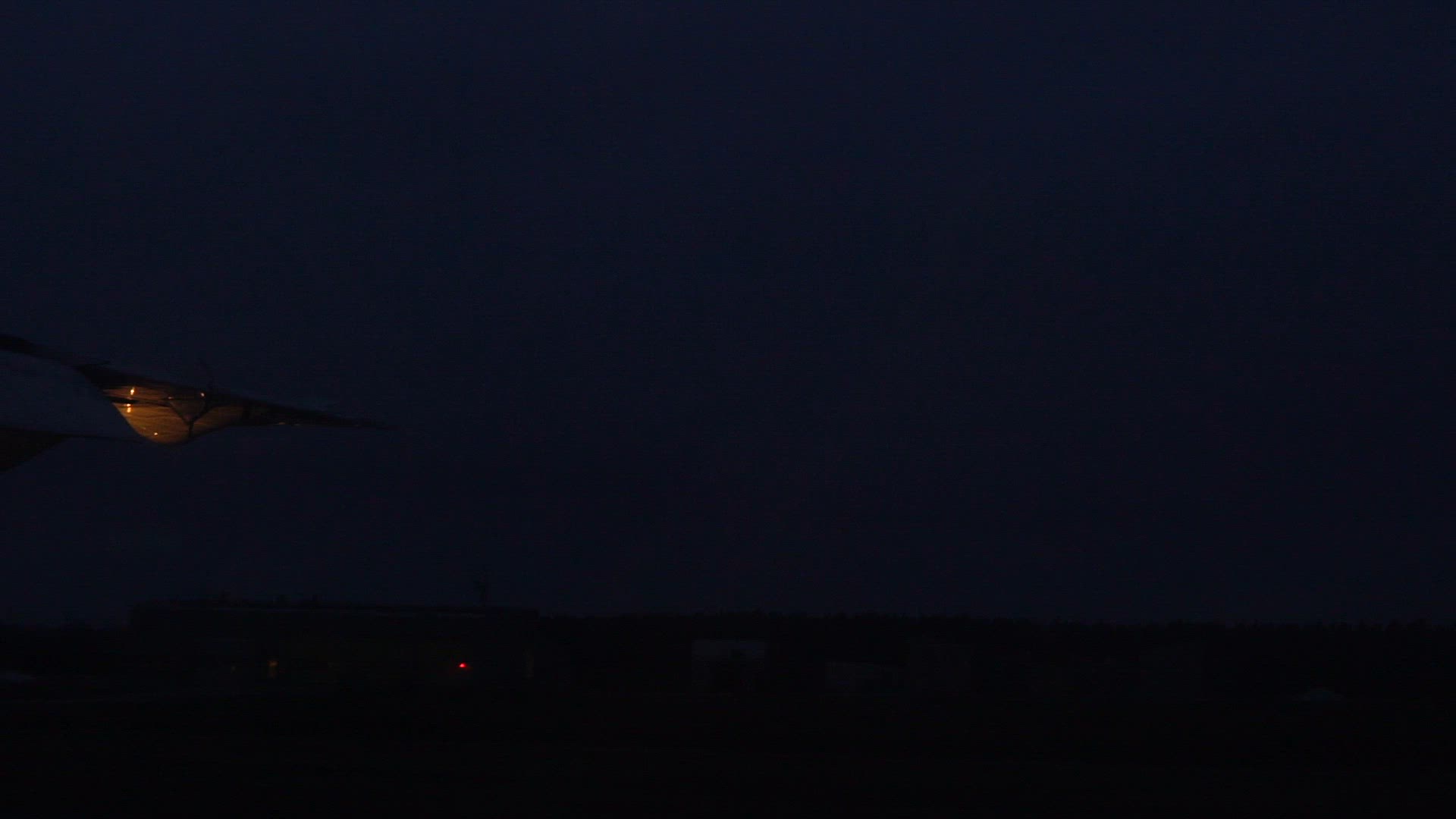 pov from airplane window - landing at Arlanda - evening - slomo.mp4