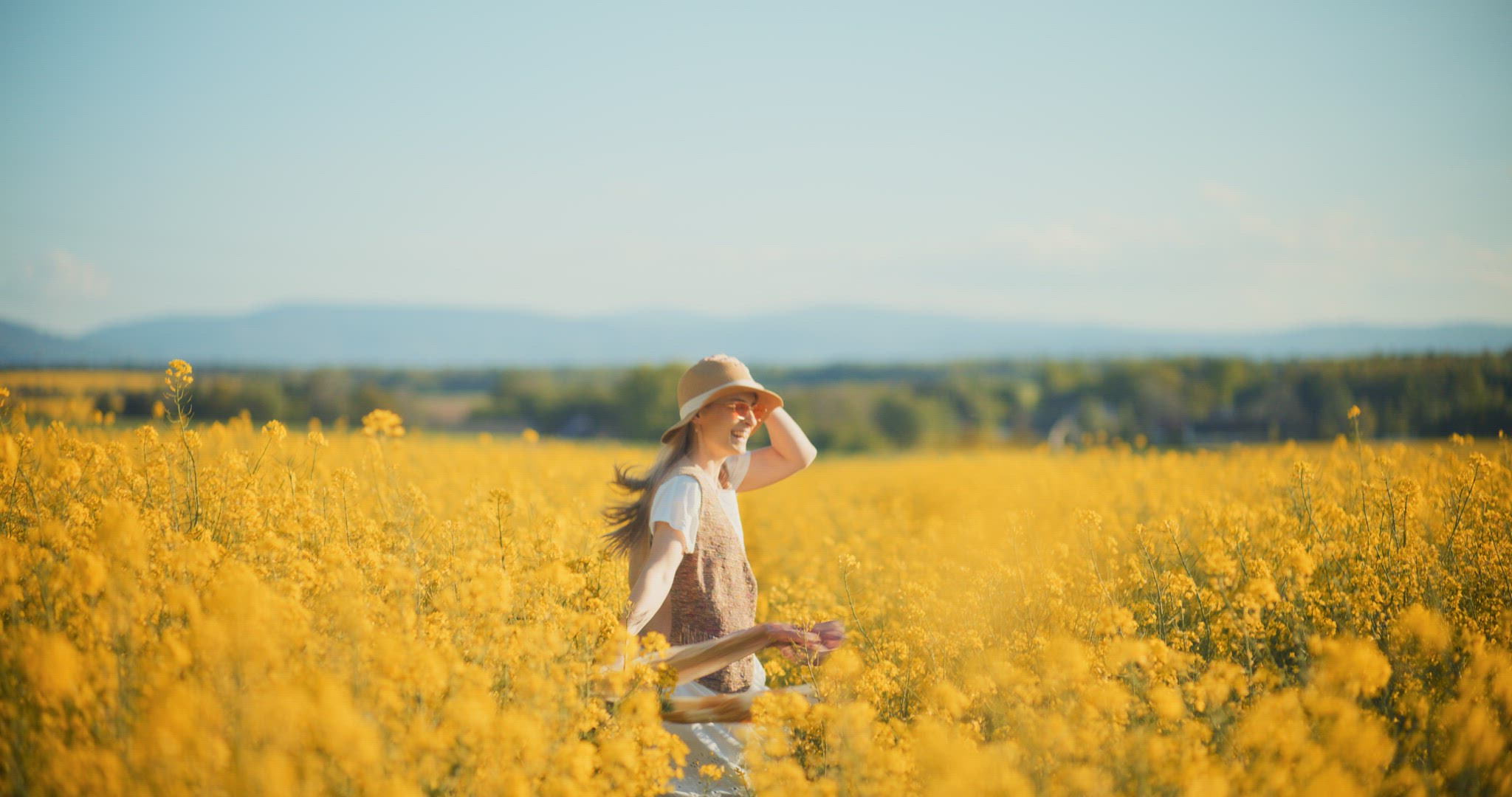 Smiling Woman Walking Rapeseed Field Portrait