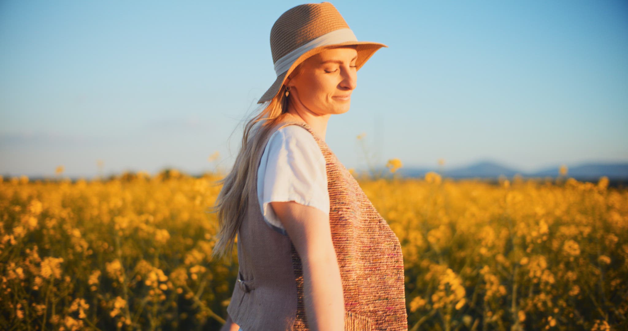 Smiling Woman Walking Rapeseed Field Portrait