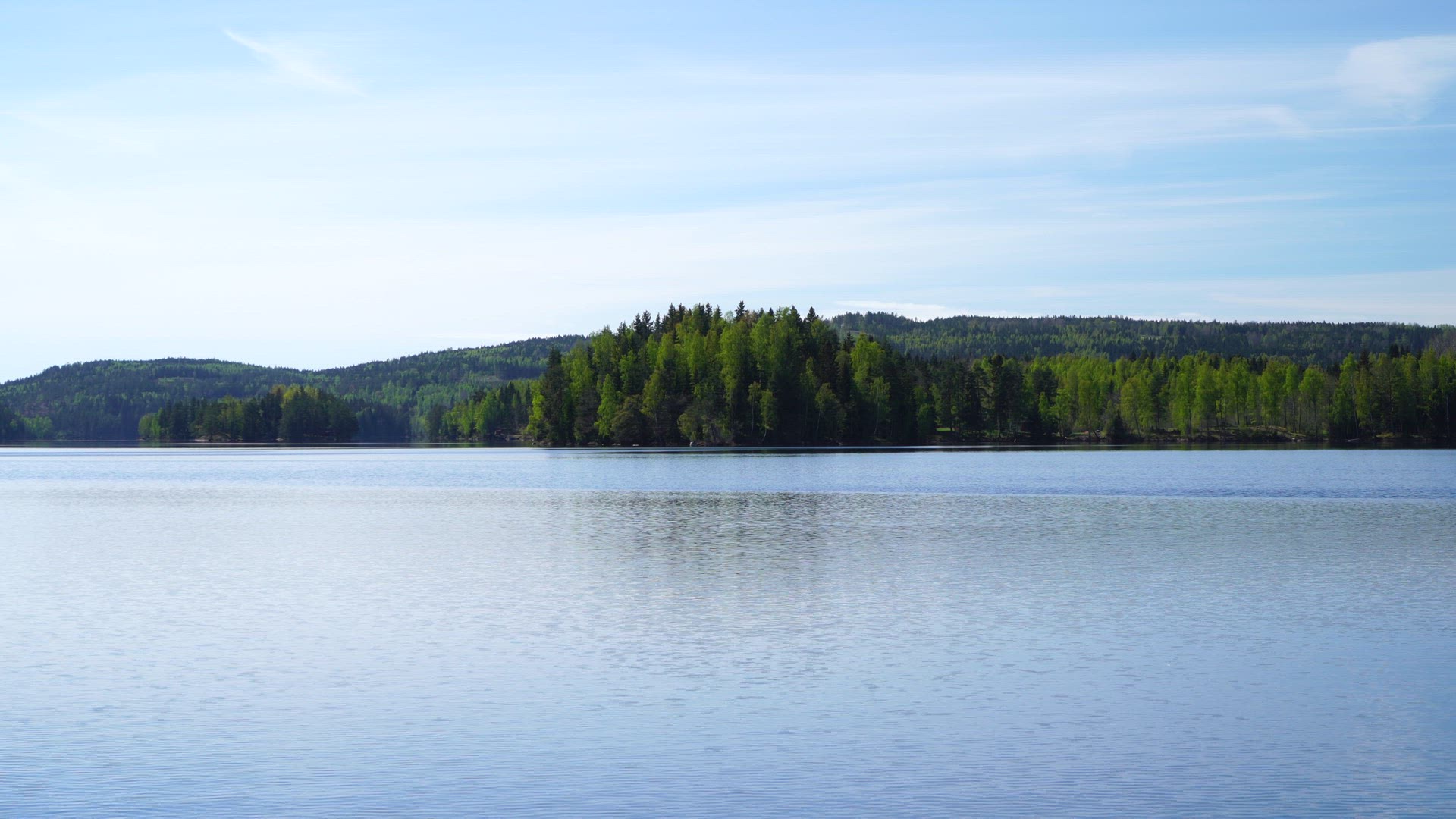 lake in Värmland - ripples on water - springtime.MP4