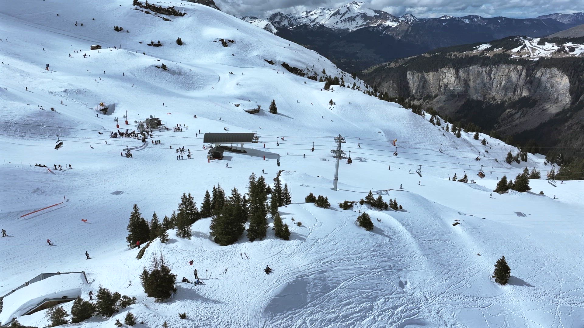 Skiers and Snowboarders on a Slope in a Resort in the French Alps