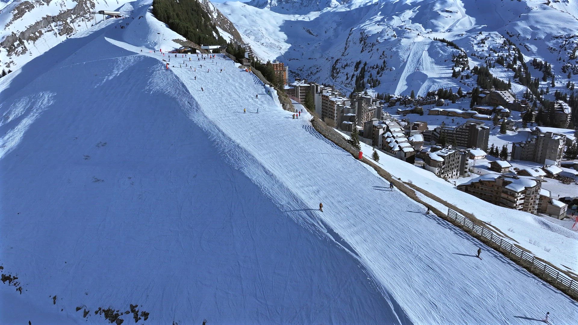 Skiing and Snowboarding on a Piste in the French Alps Aerial View