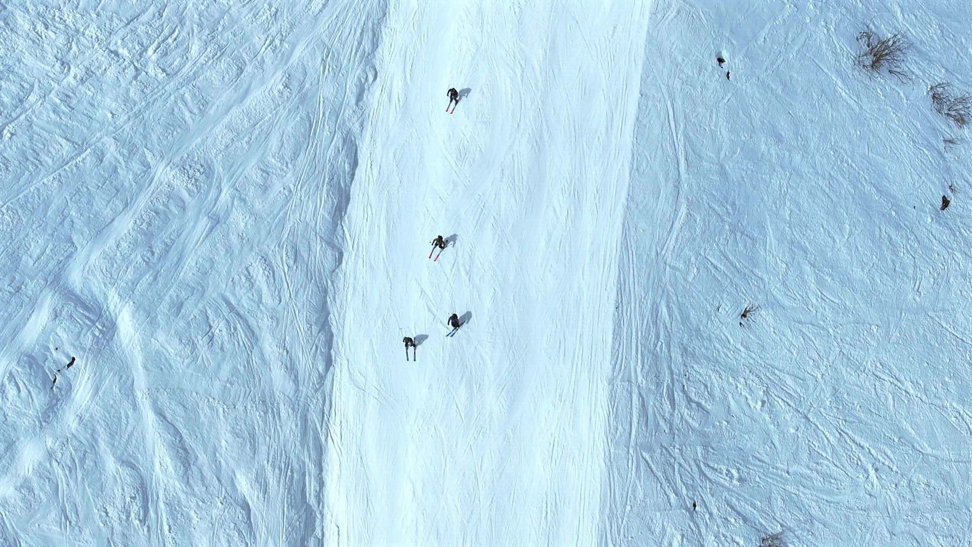 Skiers and Snowboarders on a Ski Run in a Resort Aerial View