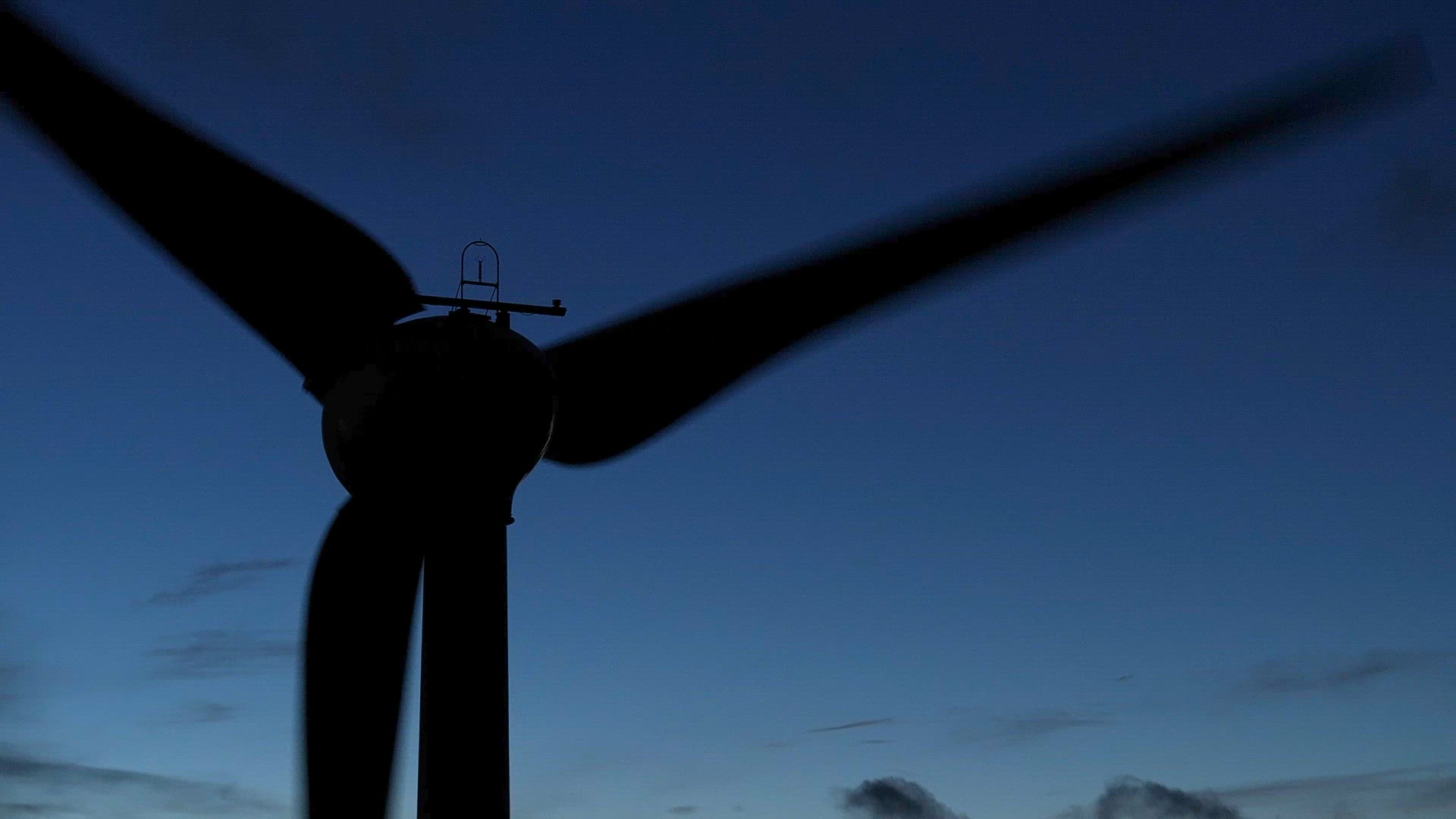 Wind Farm Turbine Operating at Night Generating Renewable Power