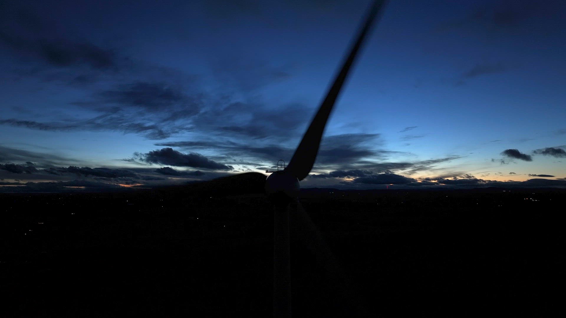 Wind Farm Turbines Generating Renewable Energy Through the Night