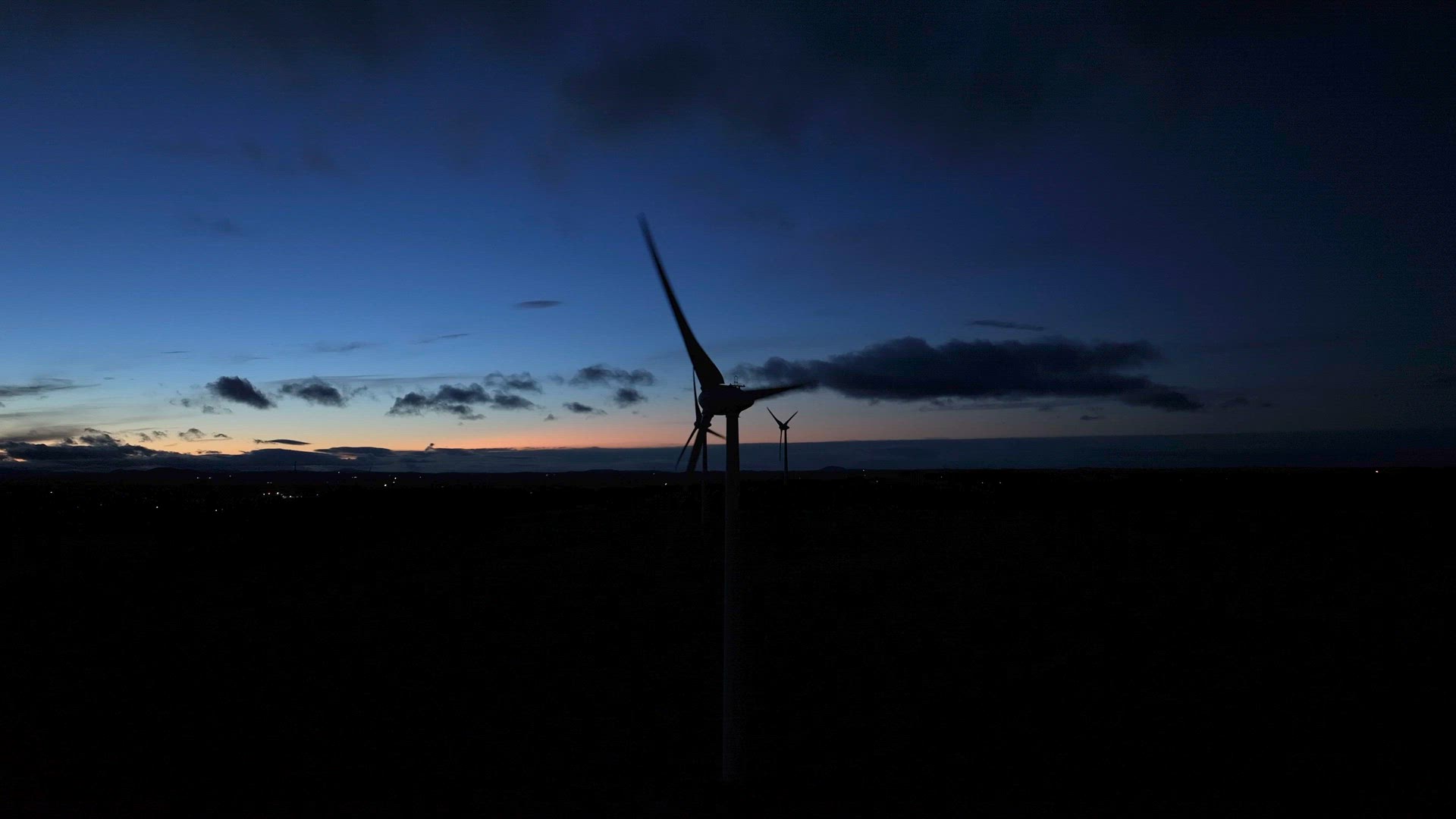 Wind Farm Turbine Operating at Night Generating Renewable Power
