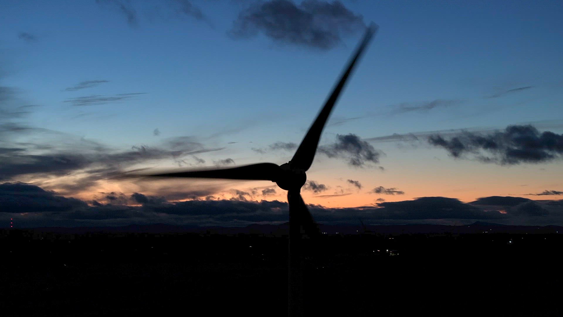 Wind Farm Turbines Generating Renewable Energy Through the Night