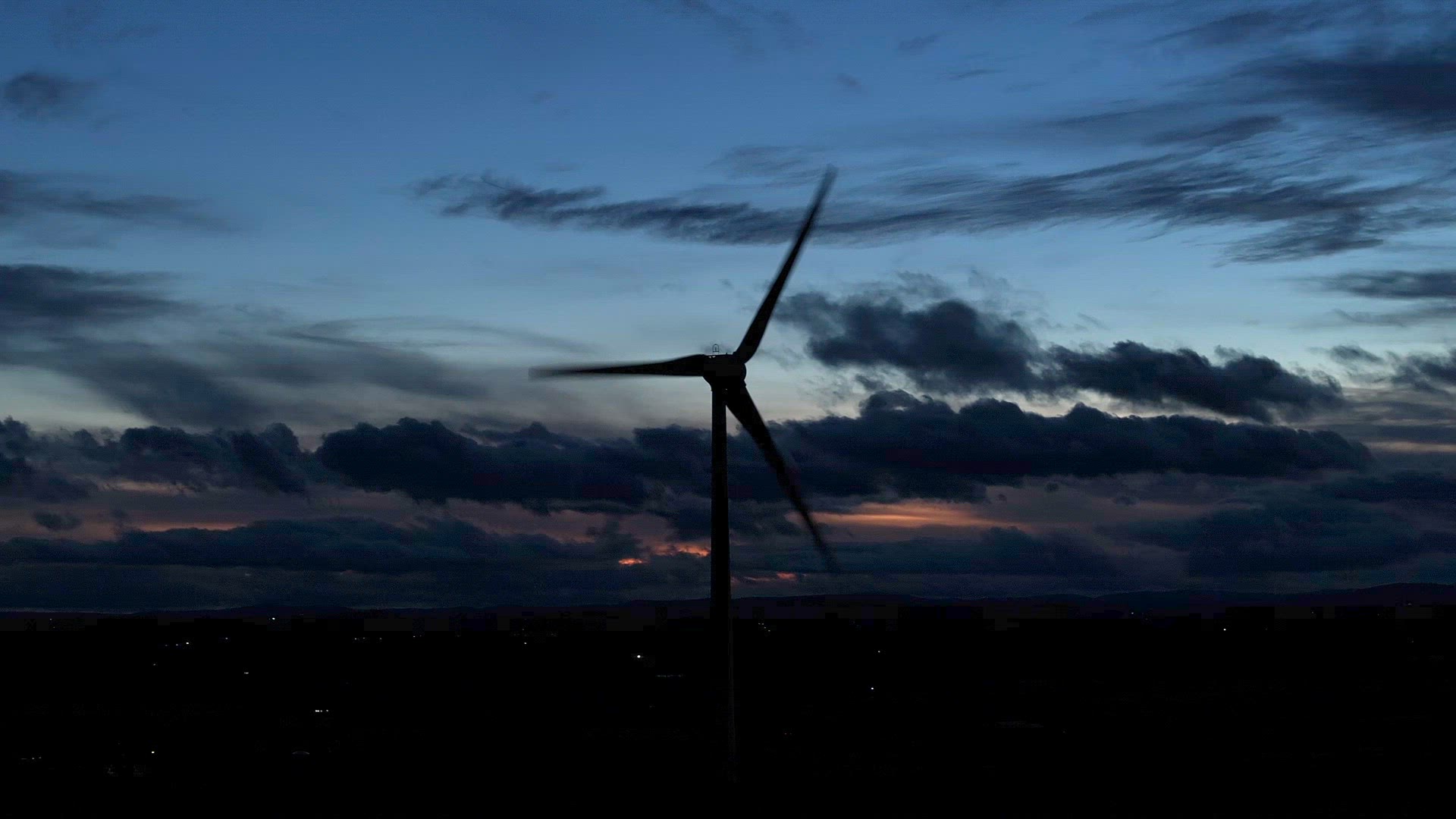Wind Farm Turbines Generating Renewable Energy Through the Night