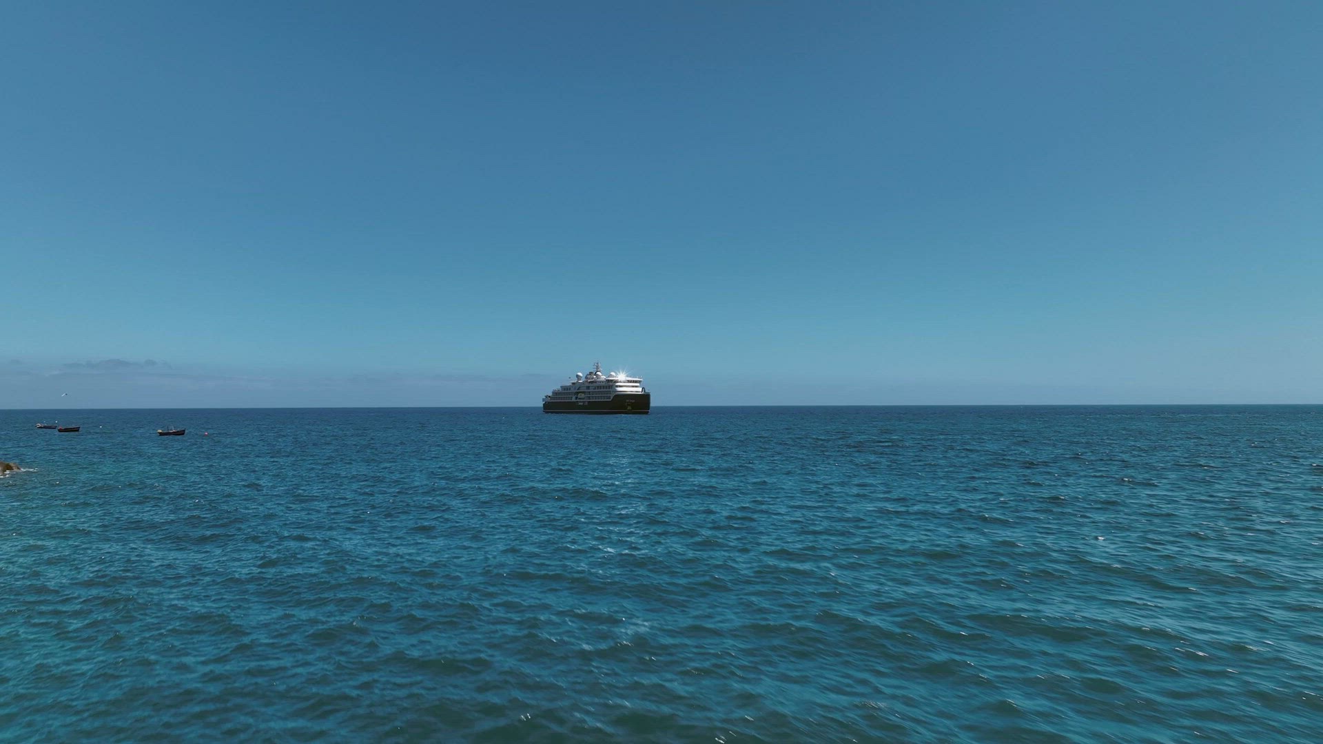 A Medium Sized Cruise Ship at Sea Aerial View
