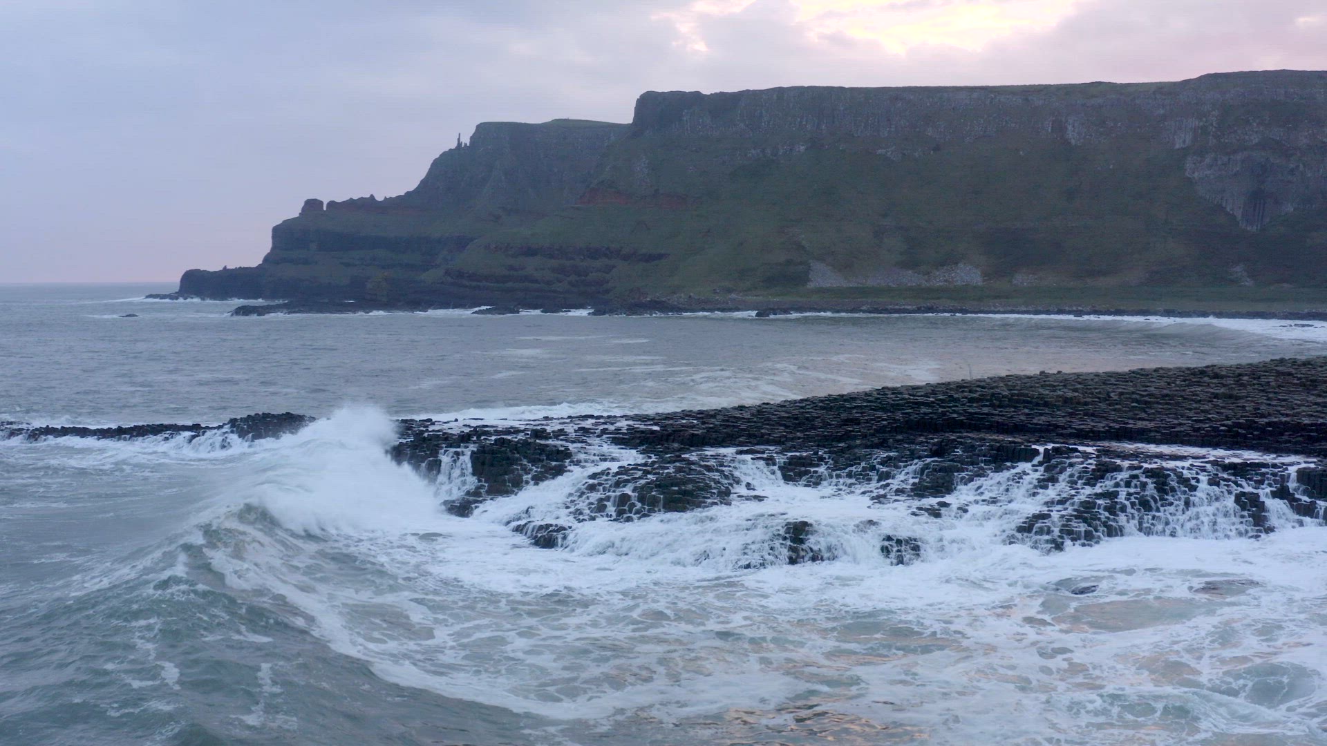 Waves Crashing Against the Famous Giant's Causeway in Northern Ireland