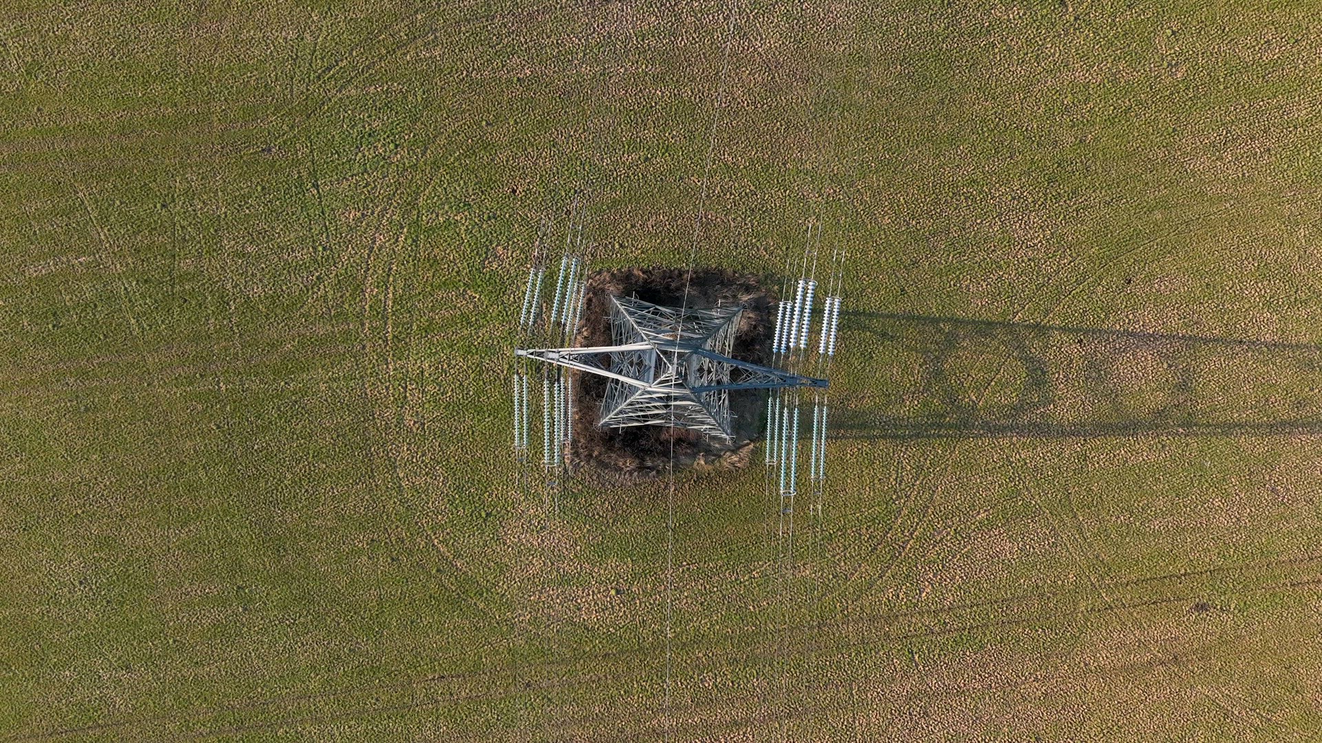 Bird's Eye View of Industrial High Voltage Lattice Power Line Tower