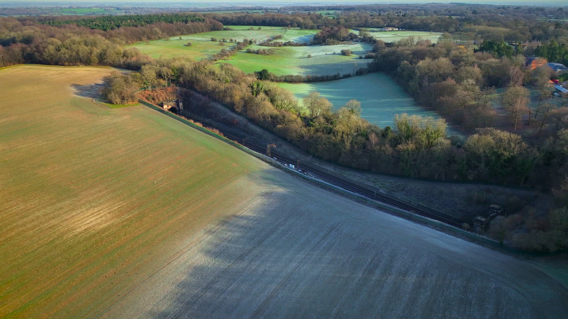 Commuter Train Speeding Through a Tunnel in the Countryside