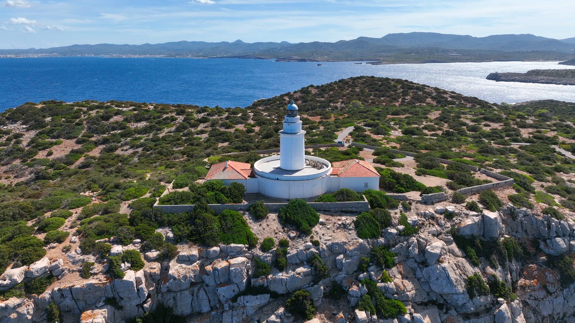 Lighthouse on a Tall Cliff Overlooking the Mediterranean Sea