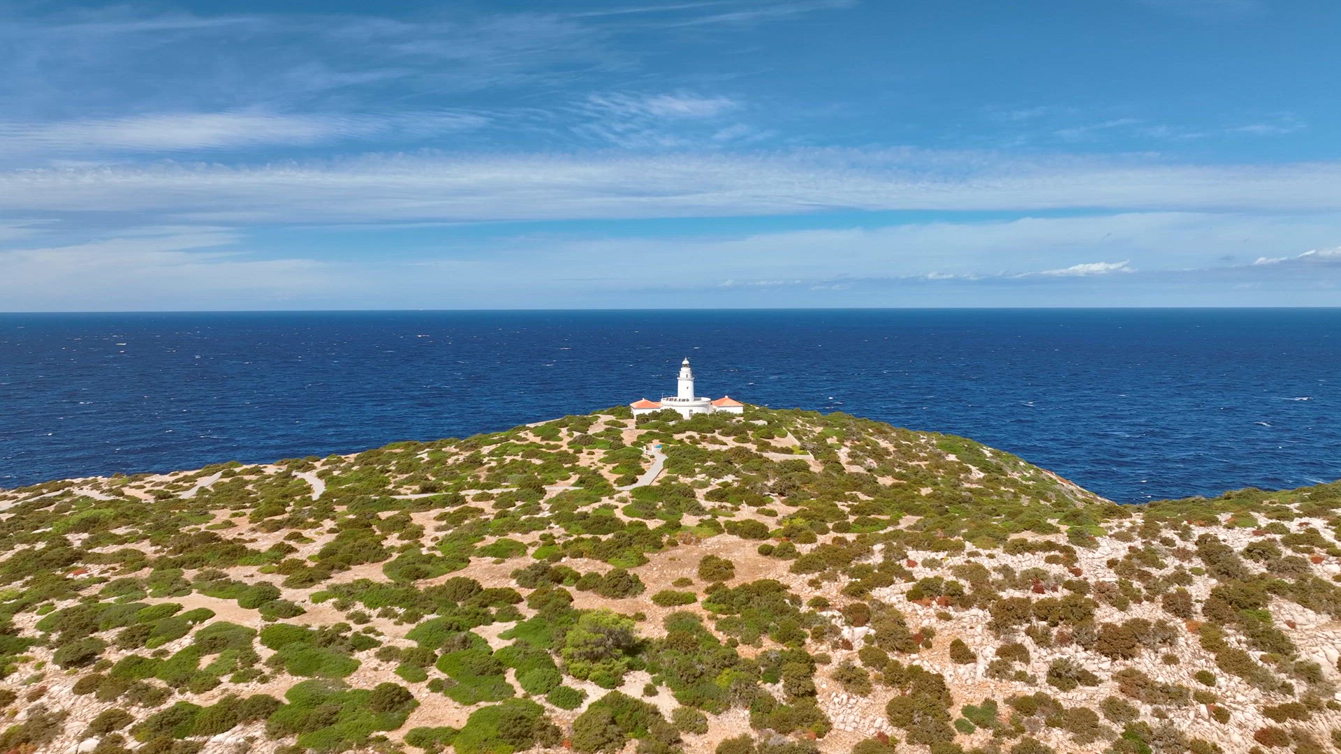 Lighthouse on a Cliff Overlooking the Ocean in Ibiza