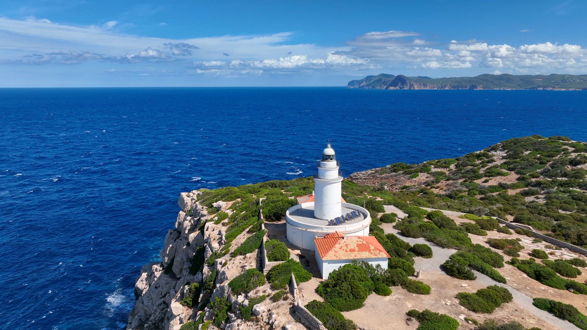 Lighthouse on a Cliff Overlooking the Ocean in Ibiza
