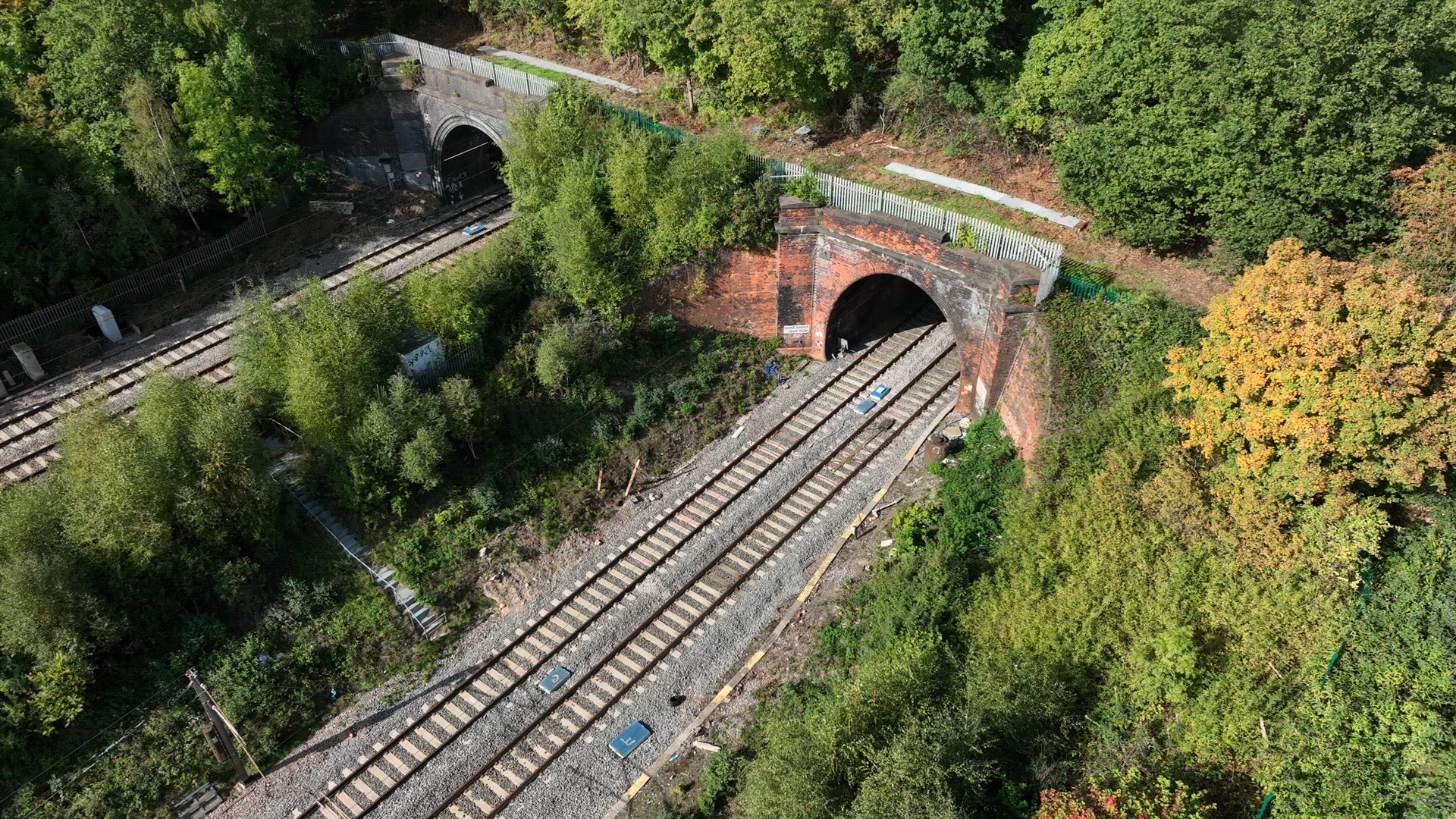 High Speed Commuter Train Entering a Tunnel Transporting Passengers